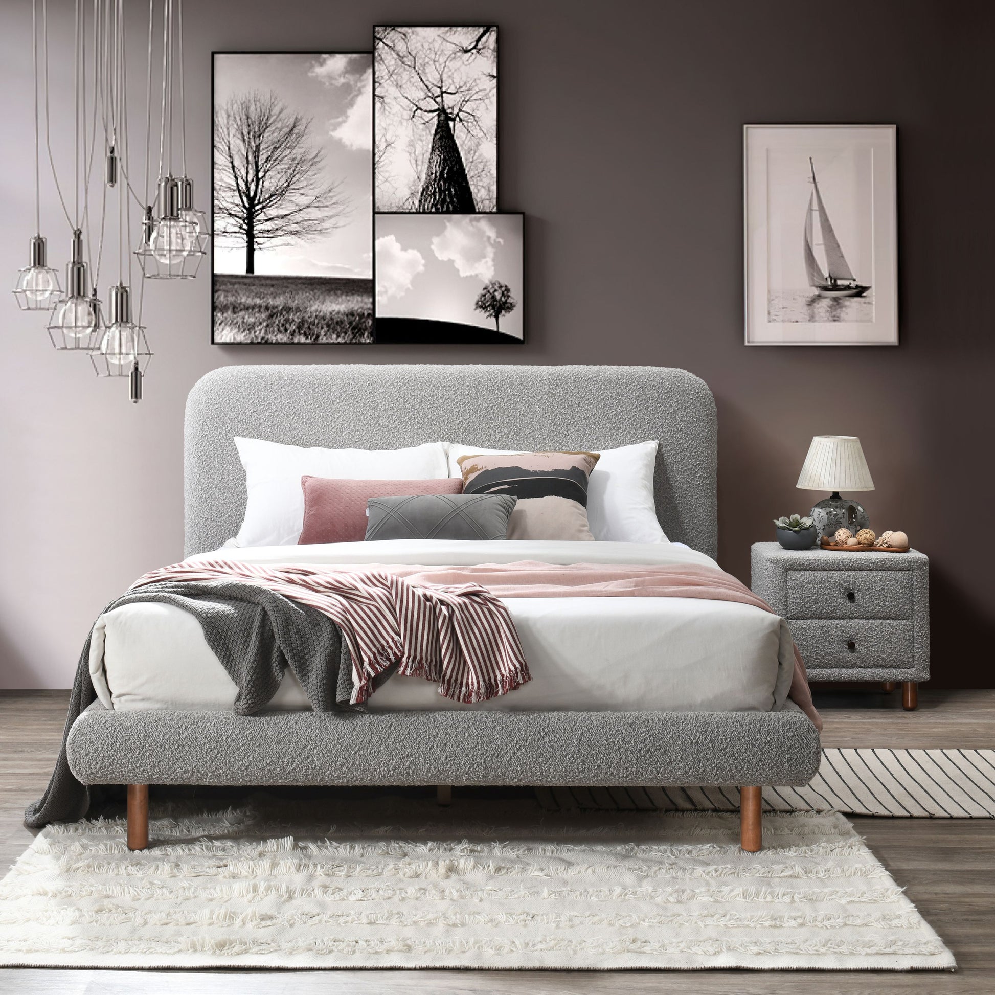 Textured grey upholstered bed frame with plush bedding and decorative pillows ideal for modern bedrooms