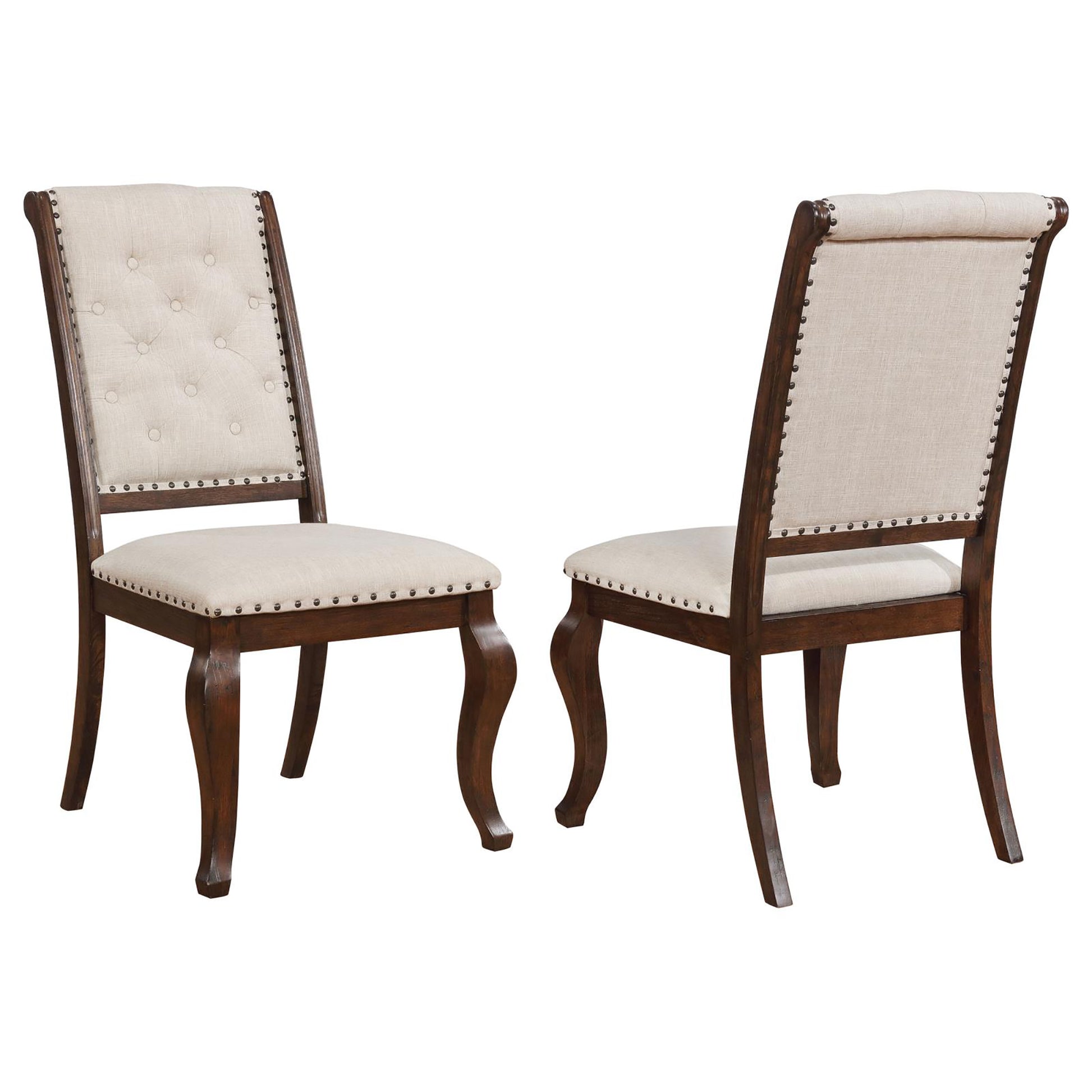 Tufted beige fabric dining chair with dark wood frame and nailhead trim