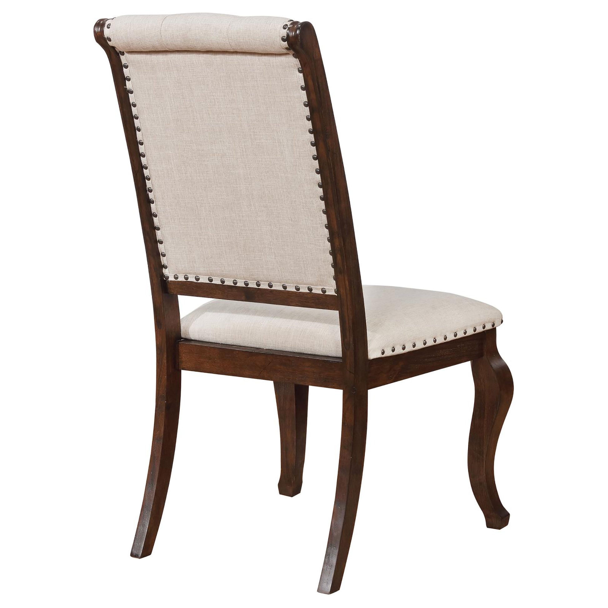 Tufted linen dining chair with nailhead trim and dark wood frame