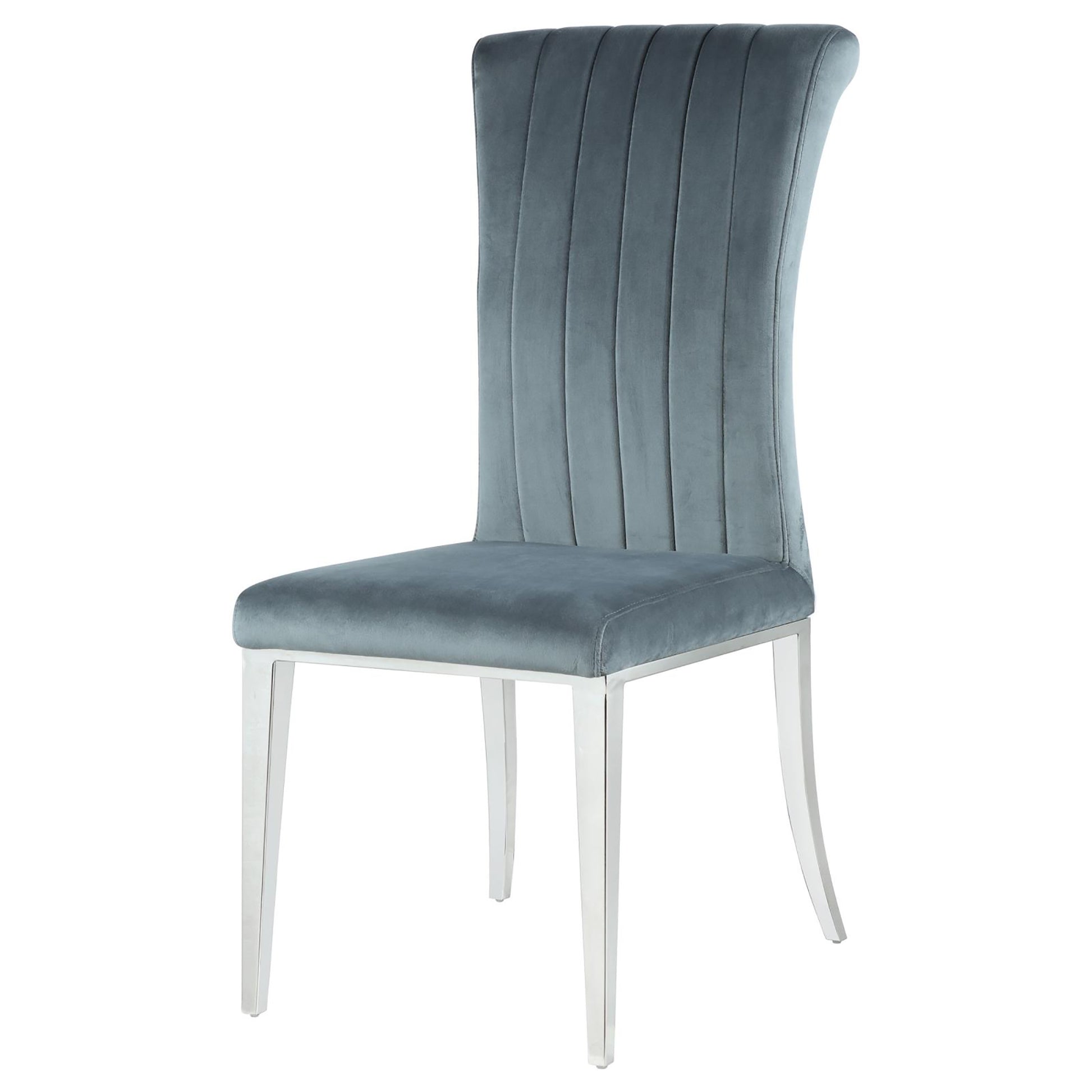 Elegant grey velvet dining chair with vertical channel tufting and sleek chrome legs