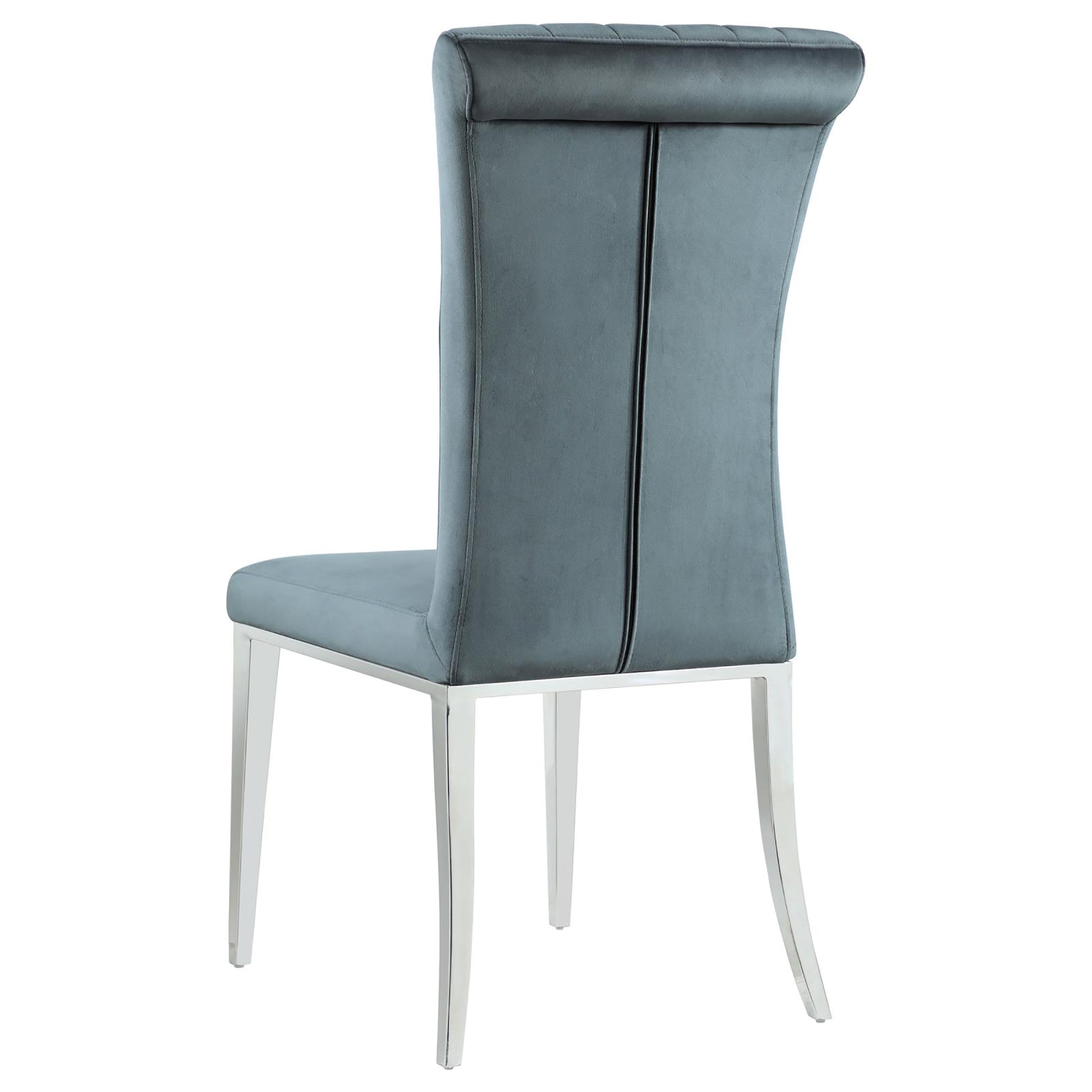 Back view of a tufted grey velvet dining chair with polished chrome legs