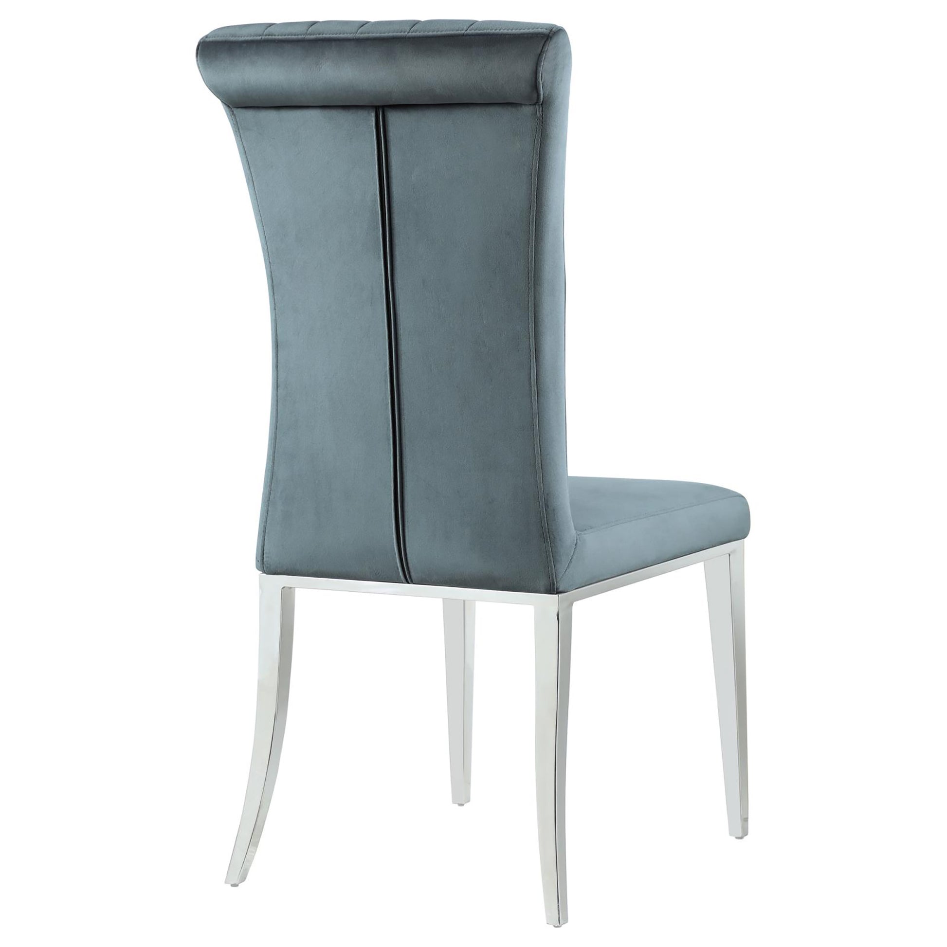Grey velvet dining chair with tufted top and silver legs
