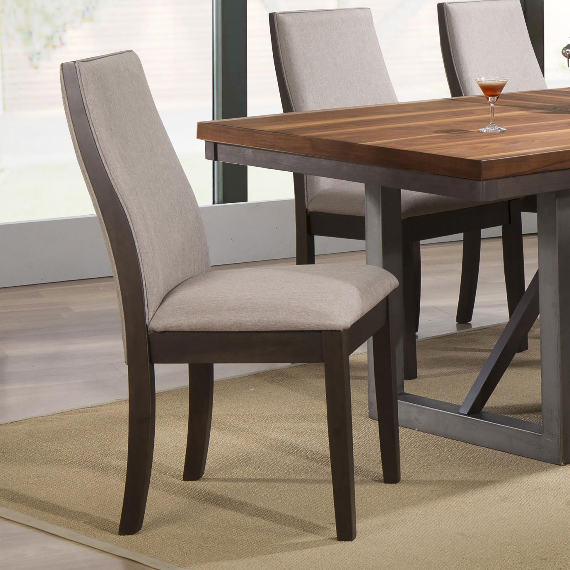 Upholstered dining chair with curved back and dark wood frame