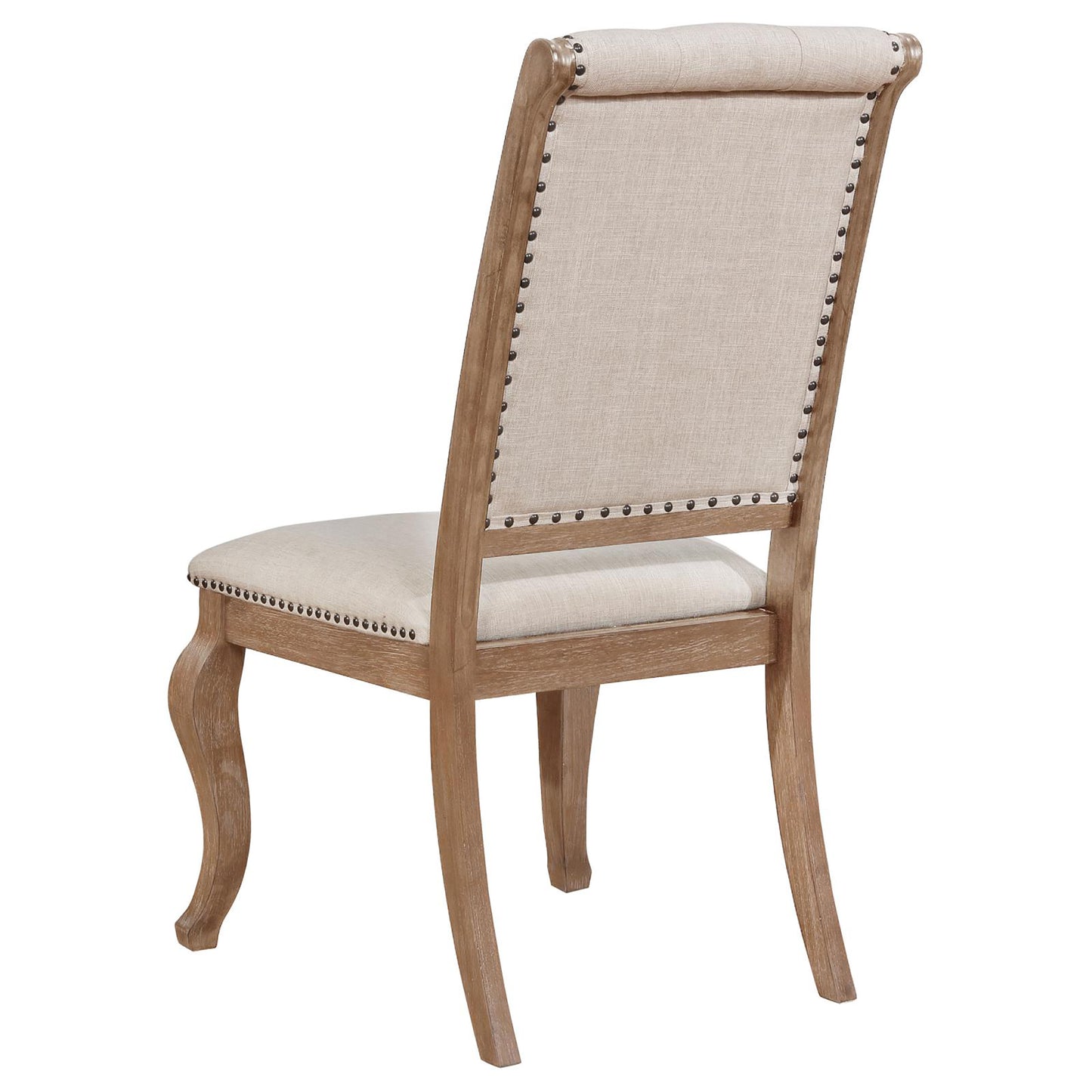 Upholstered dining chair with light beige fabric and nailhead trim accent