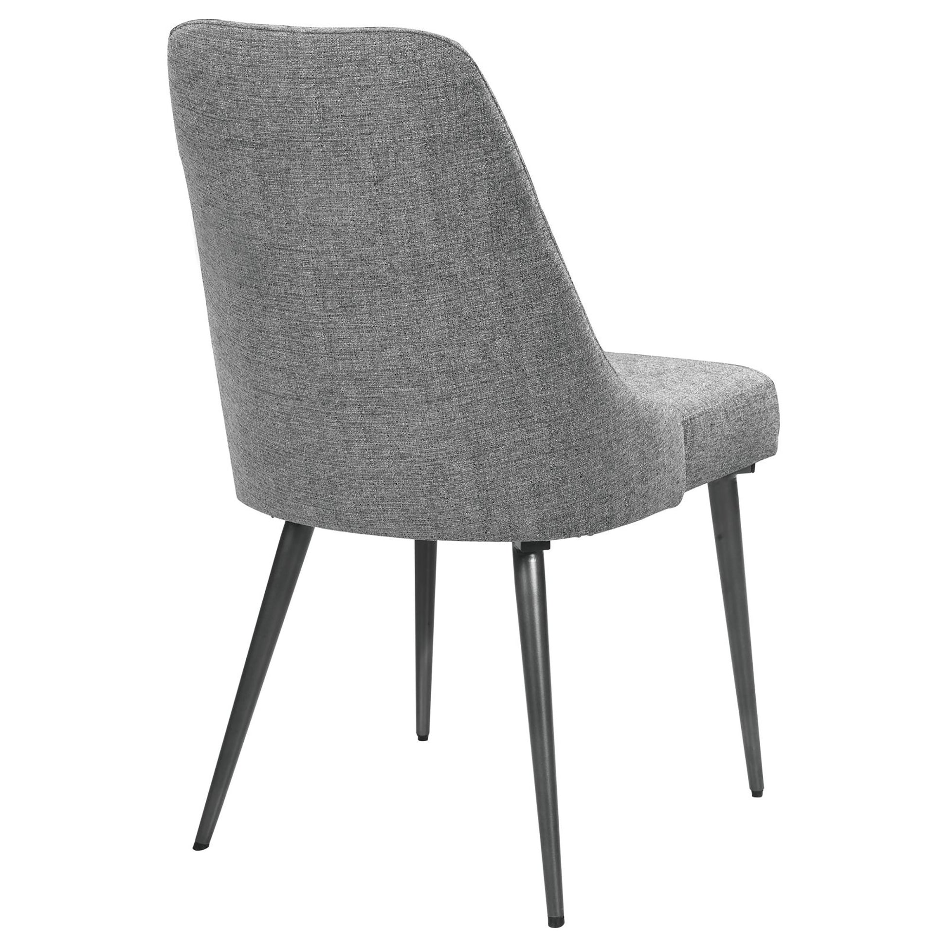 Gray upholstered dining chair with tapered metal legs from the back