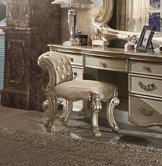 Ornate tufted vanity stool in champagne velvet with carved legs