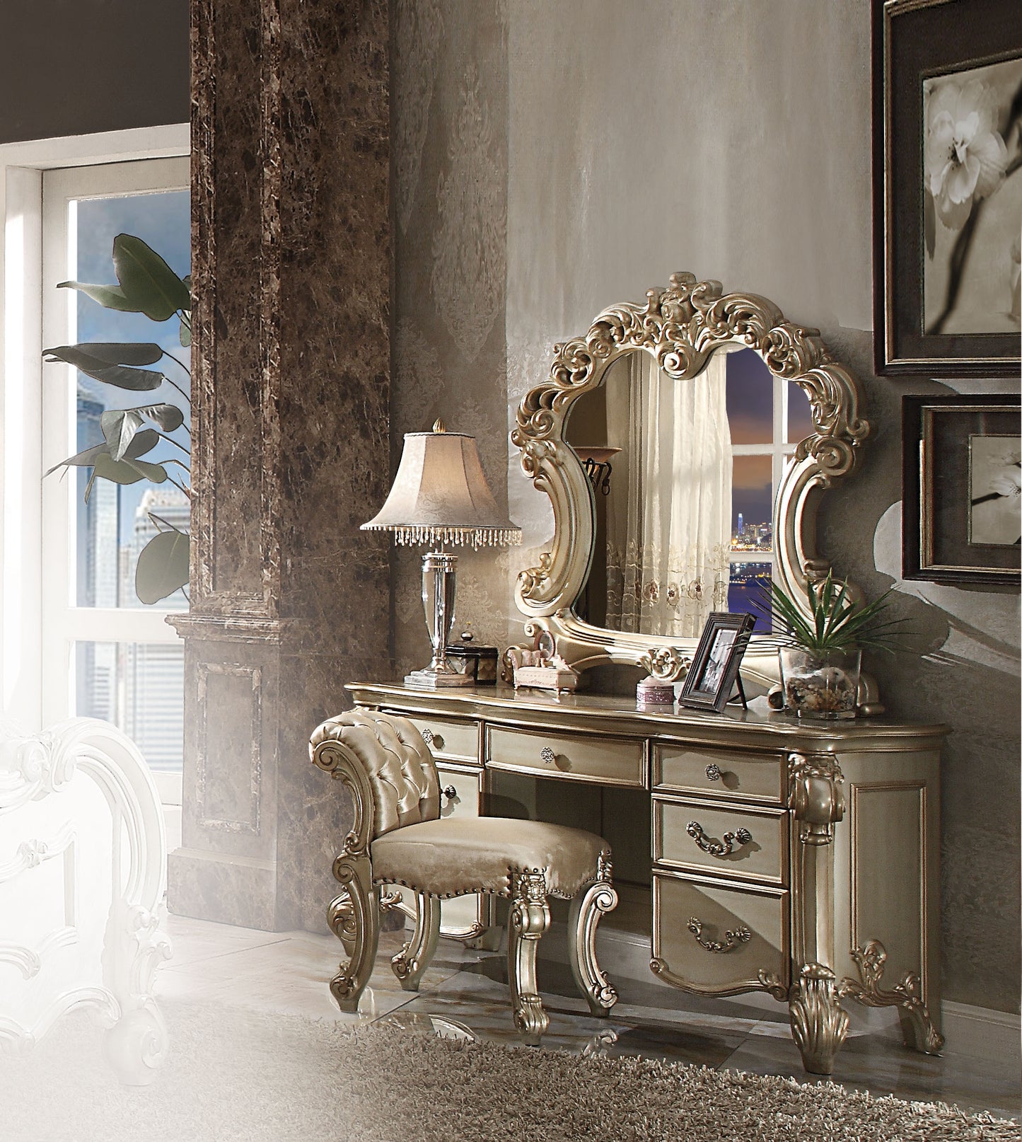 Ornate gold vanity table with tufted stool perfect for a classic bedroom set