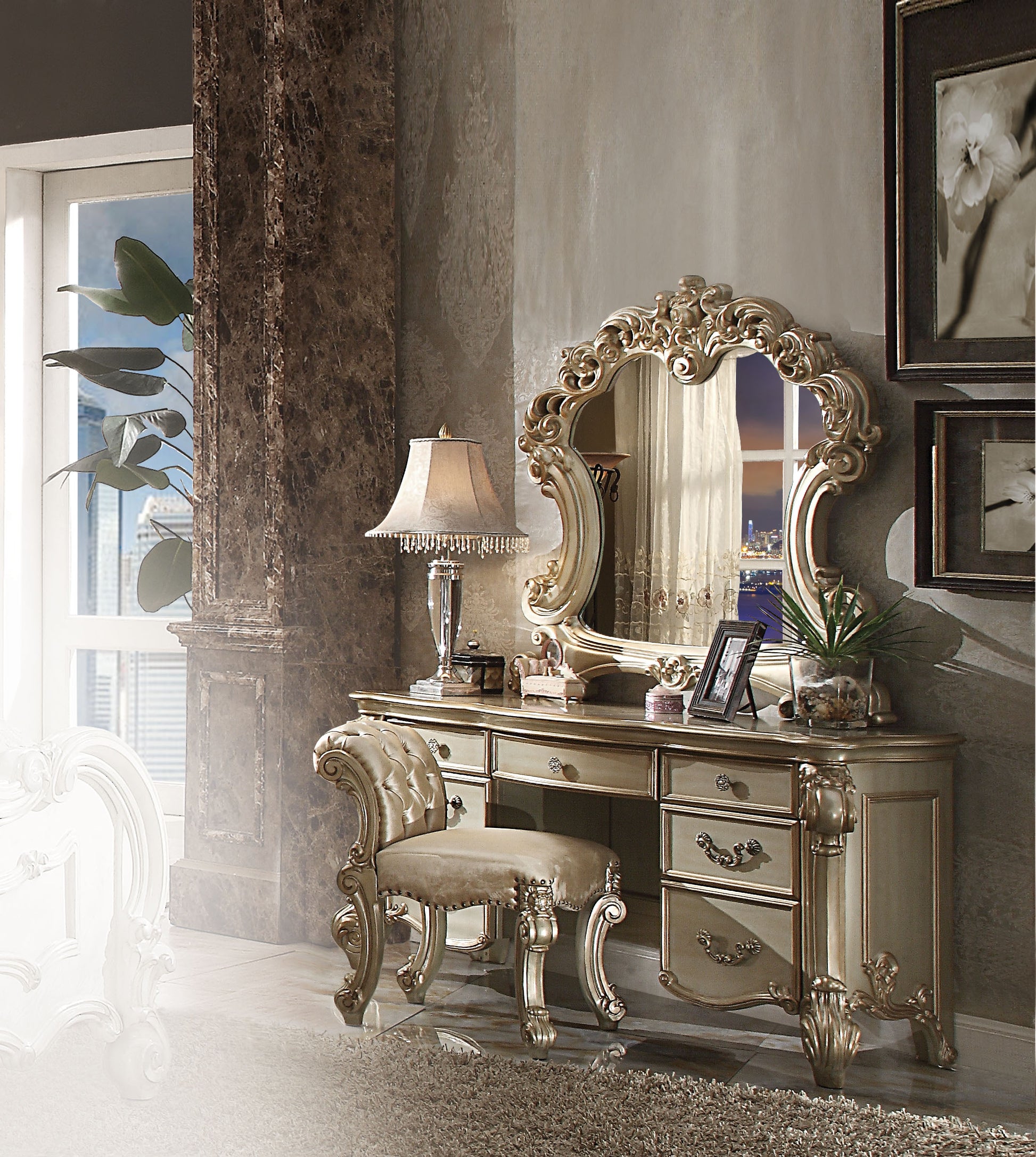 Ornate gold vanity table with tufted stool perfect for a classic bedroom set