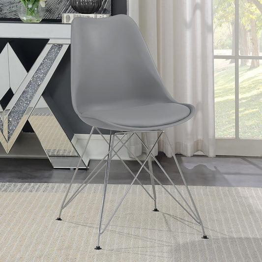 Modern grey plastic dining chair with chrome wire legs on a beige rug