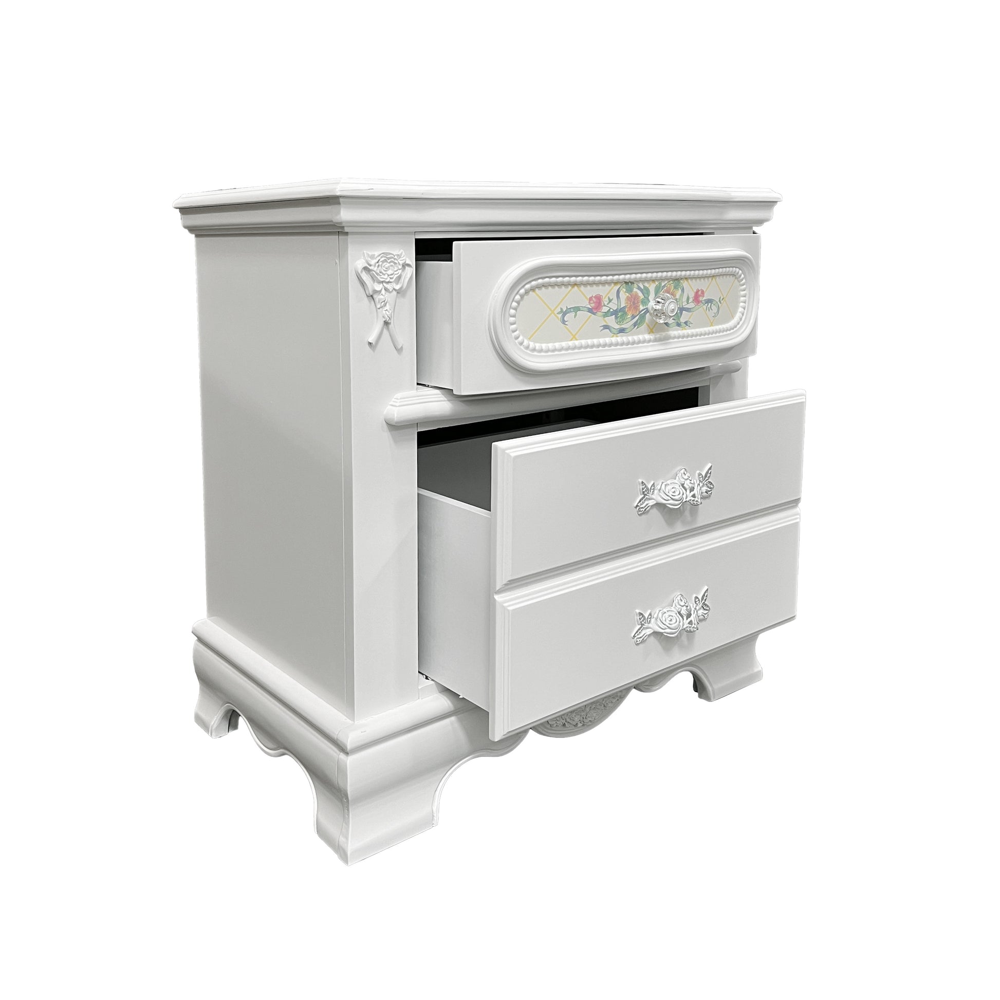 White ornate nightstand with floral drawer pulls and a decorative top drawer panel