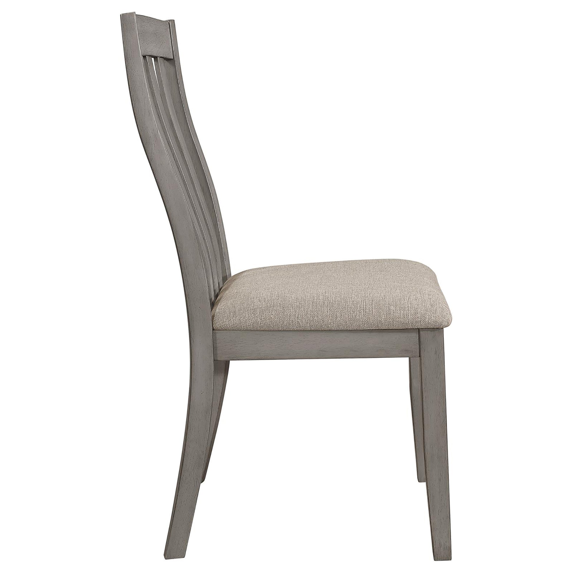 Side view of a grey wooden dining chair with a neutral upholstered seat