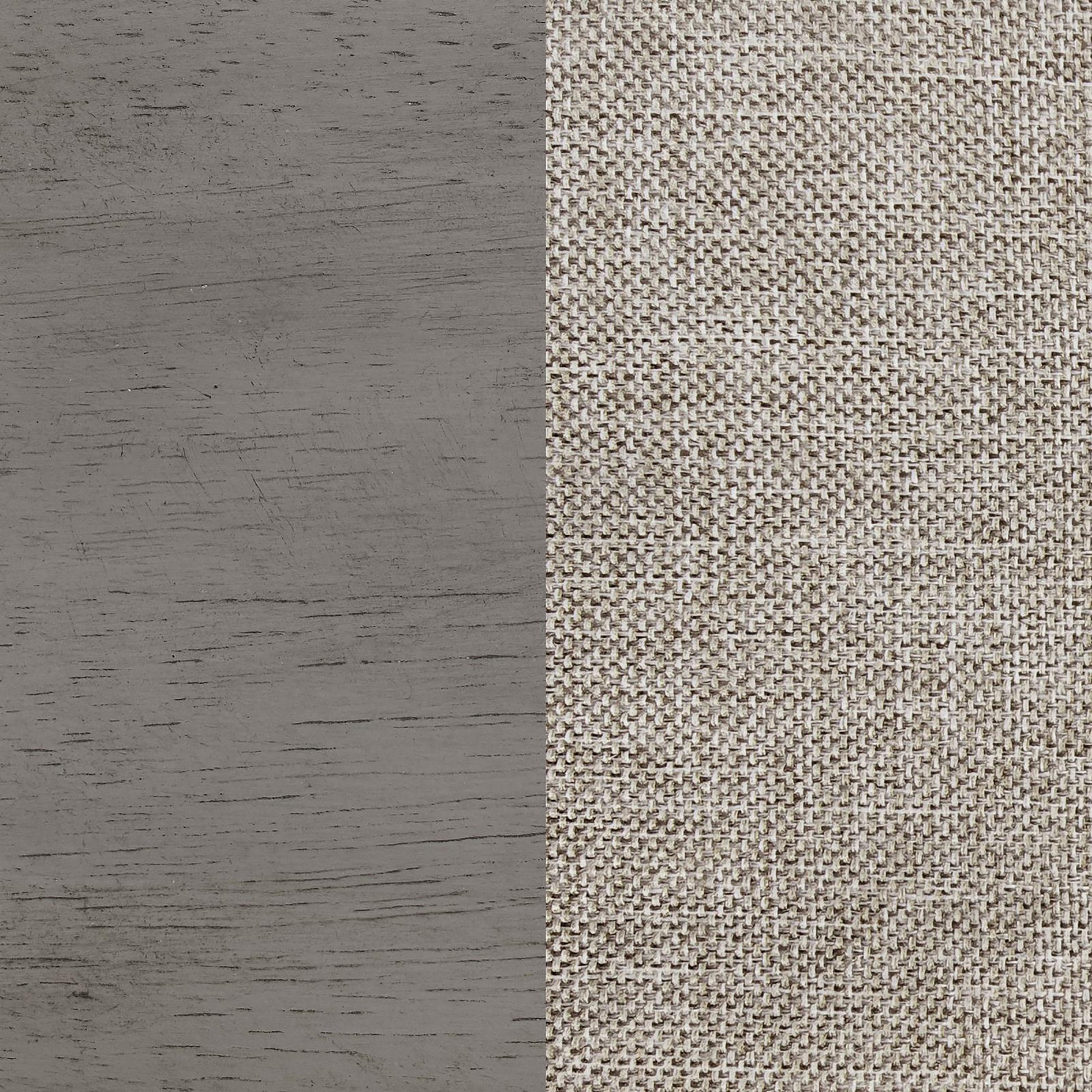 Closeup of a textured grey wood grain surface on the left contrasted with a woven beige fabric on the right