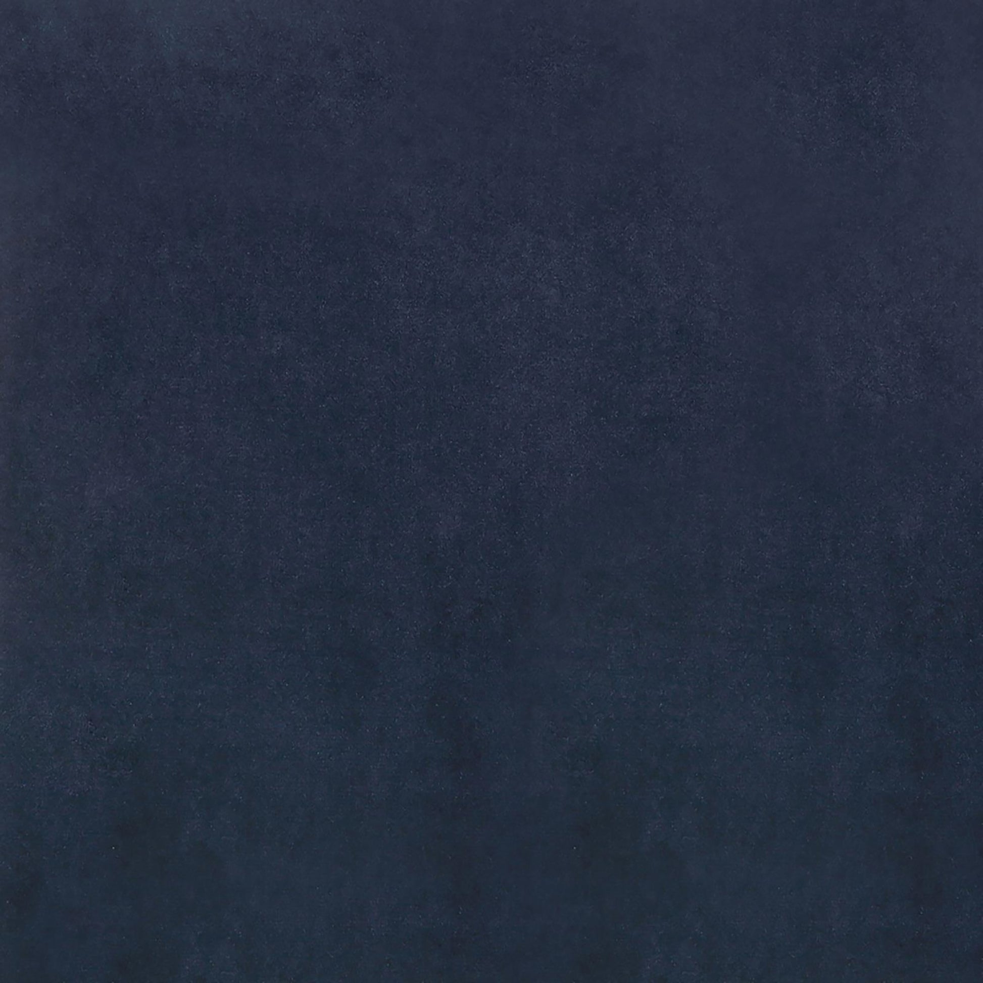 Navy blue velvet fabric with a soft plush texture for upholstery projects