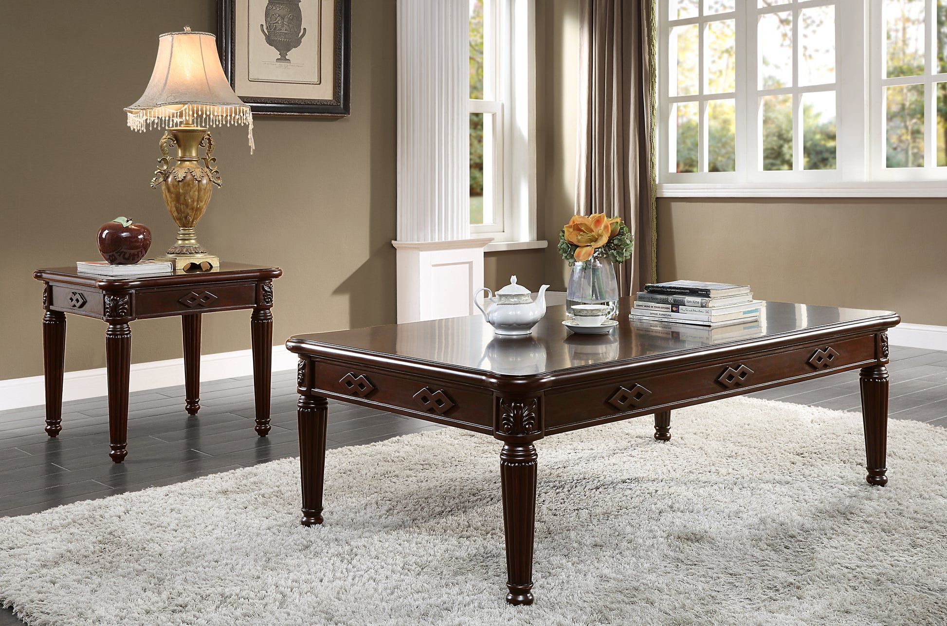 Elegant mahogany coffee table with ornate carvings and decorative legs