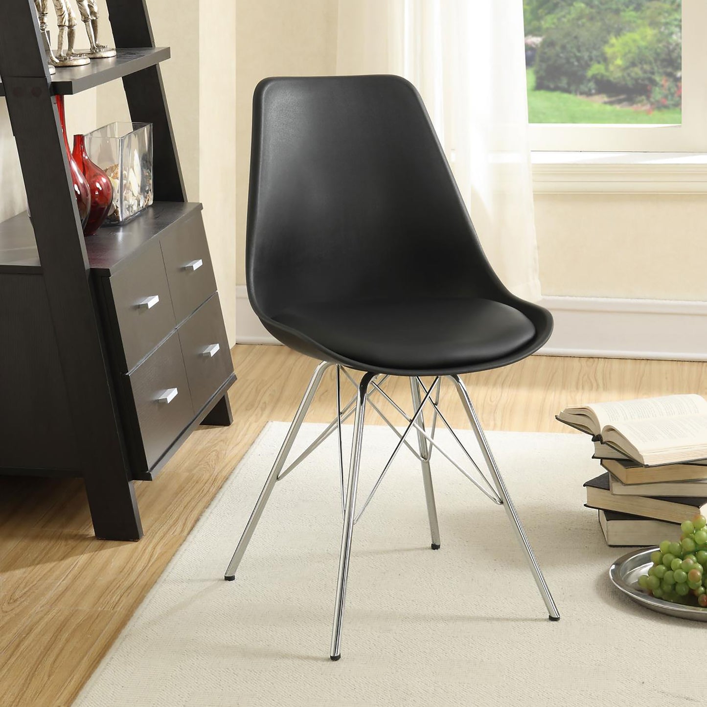 Black molded accent chair with chrome Eiffel legs perfect for modern dining rooms