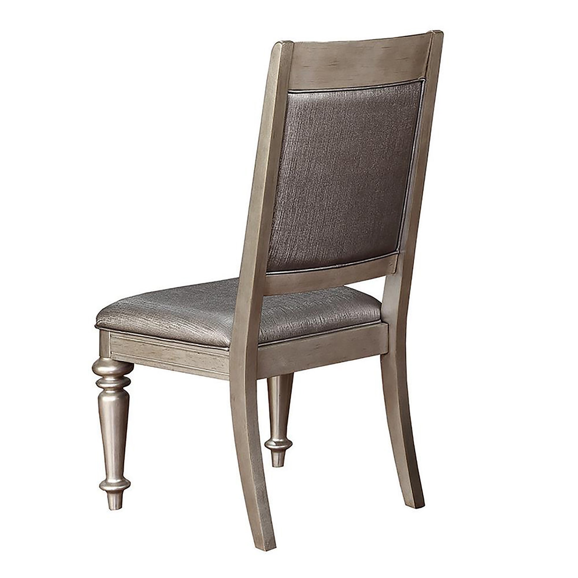 Gray upholstered dining chair with wood frame and turned legs