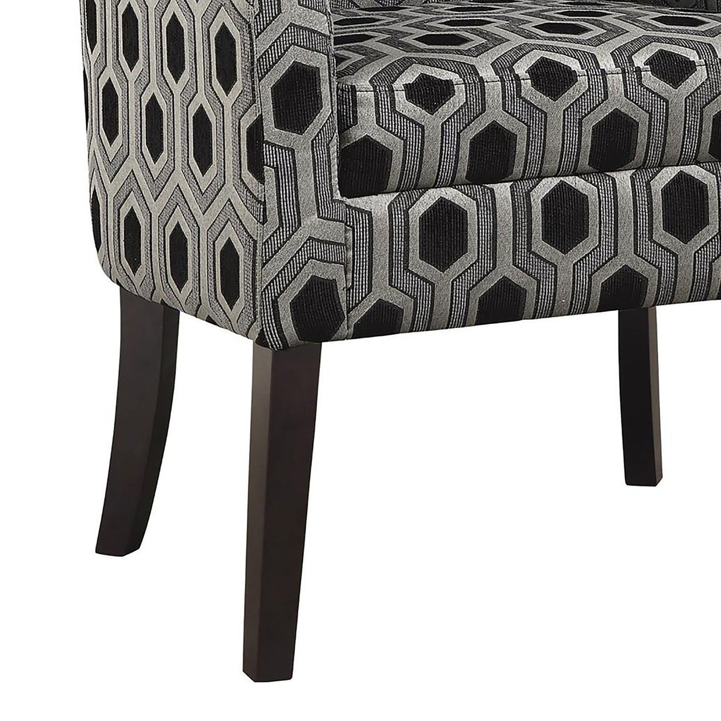 Closeup of a modern accent chair with black and grey geometric hexagon pattern upholstery