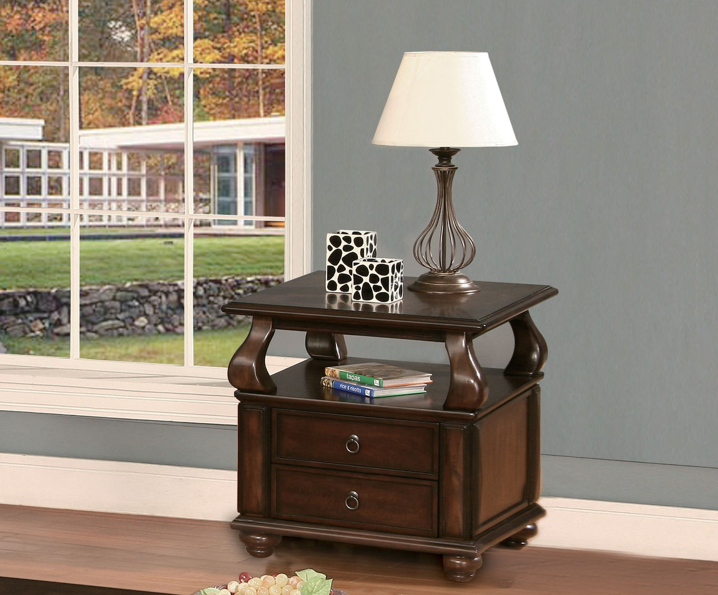 Dark wood accent table with two drawers and ornate metal lamp