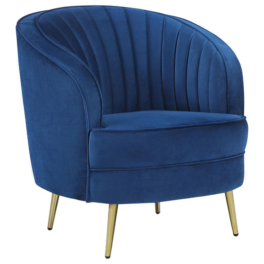 Deep blue velvet accent chair with gold tapered legs and channel tufting
