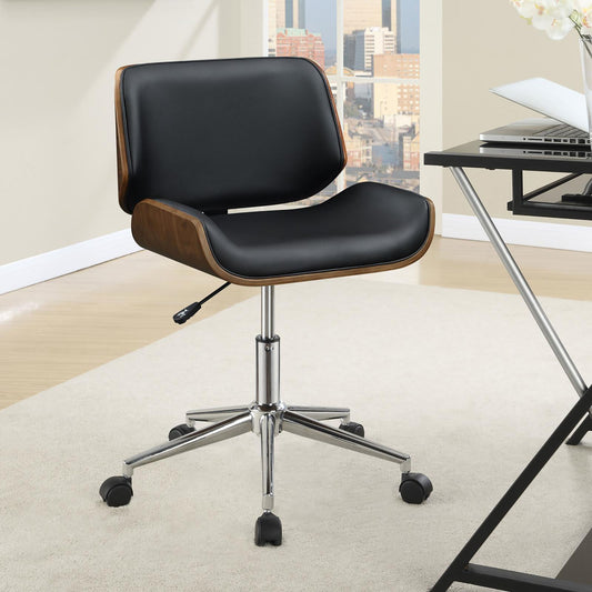 Black leather ergonomic office chair with wood accents and chrome base