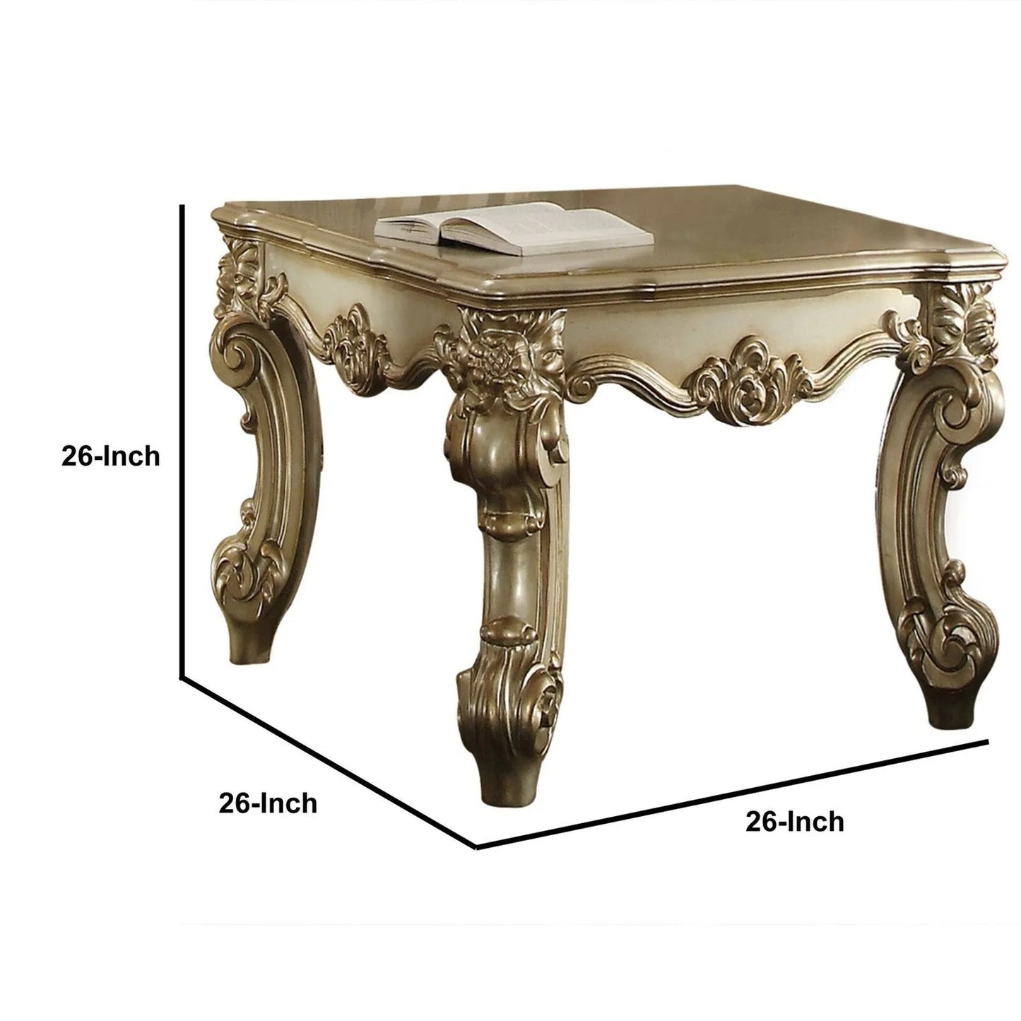 Ornate gold and cream square end table with carved details and an open book