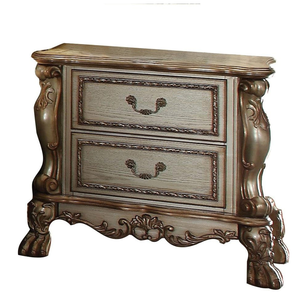 Antique white twodrawer nightstand with ornate carved detailing and bronze hardware
