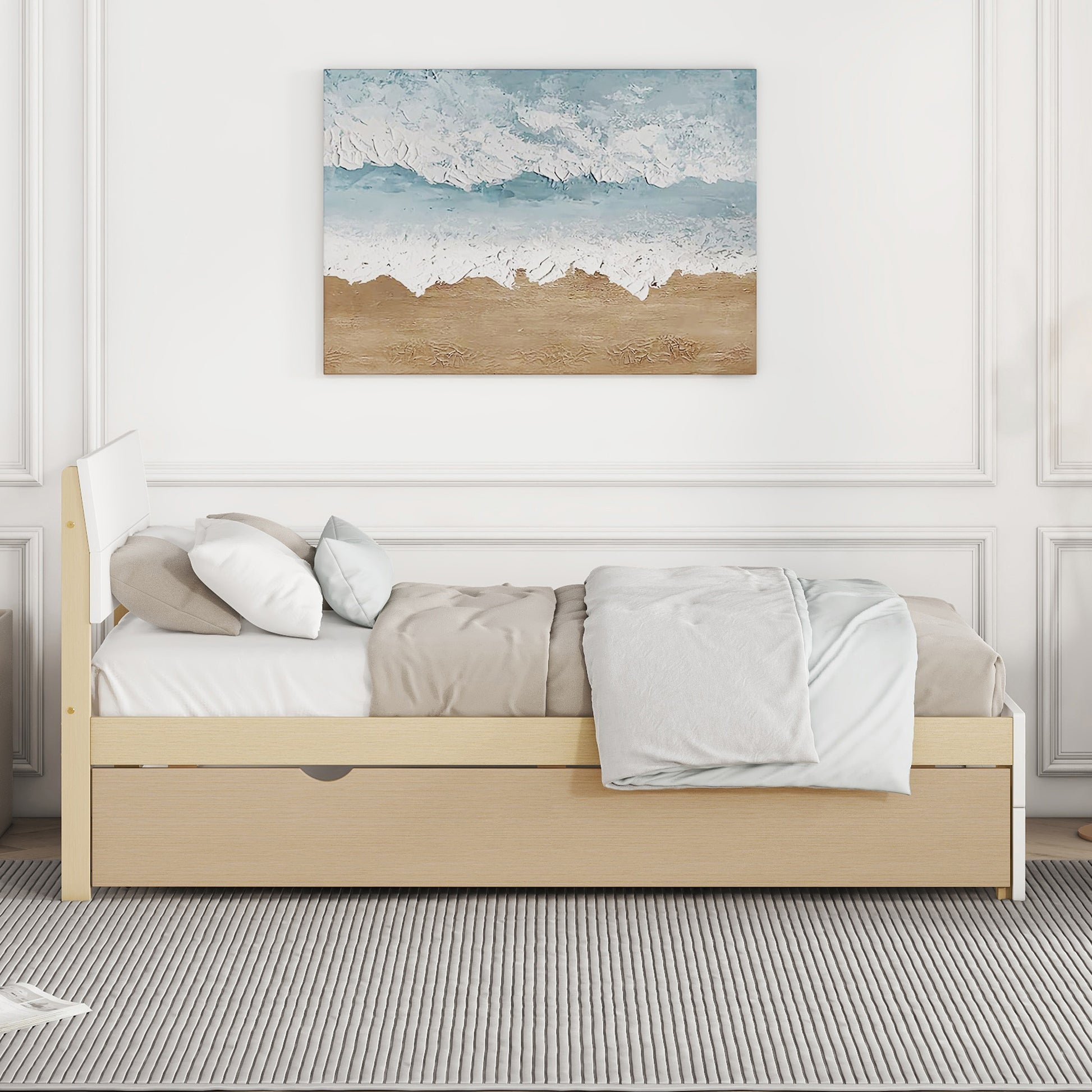 Wooden daybed with pullout drawer and neutral bedding