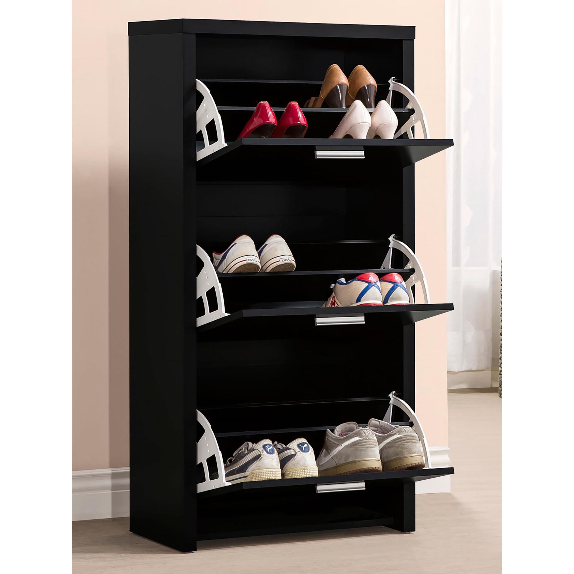 Tall black shoe cabinet with flipdown doors holding various womens heels