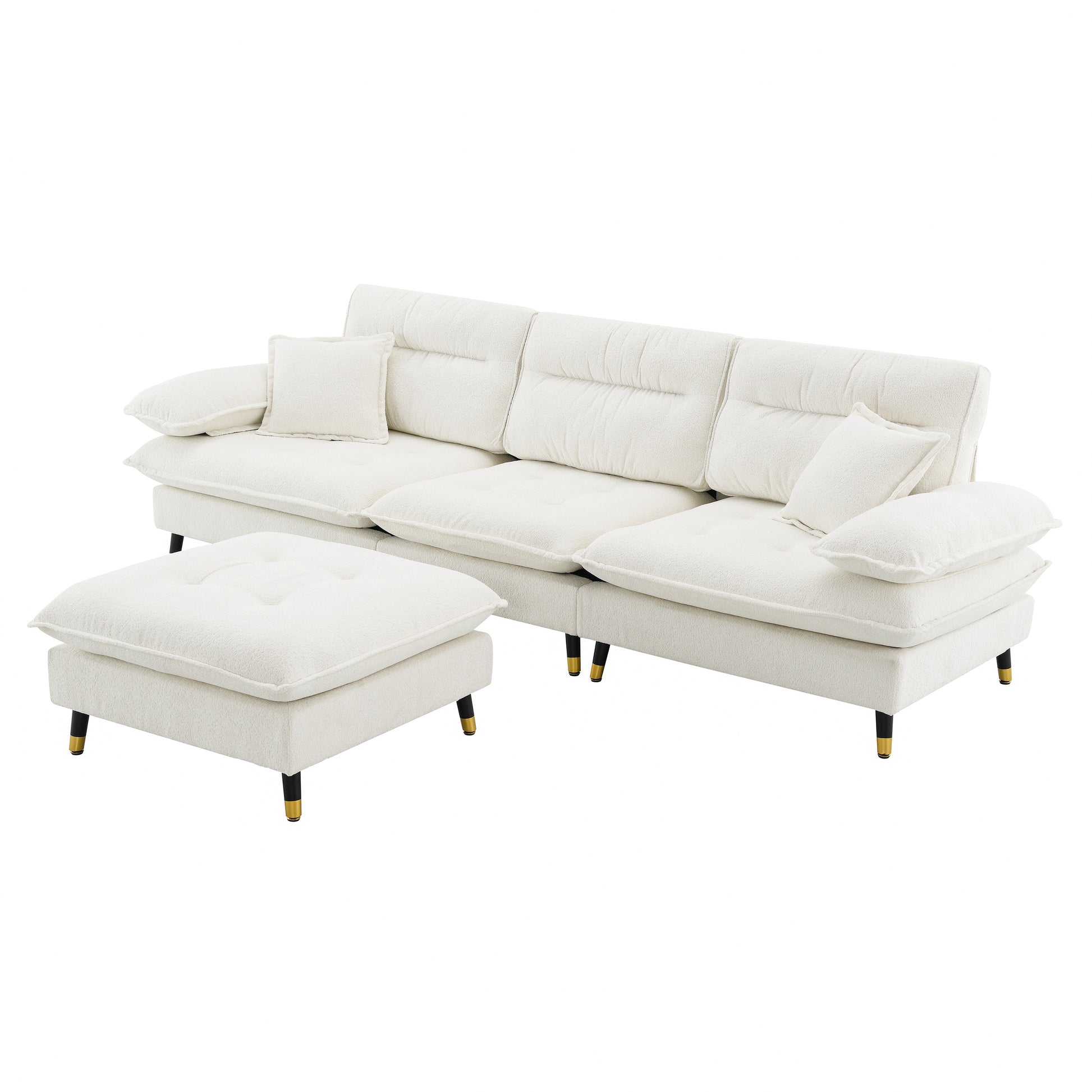 Cream boucle sofa with matching ottoman featuring tufted cushions and goldtipped black legs