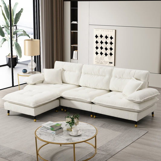 Plush white sectional sofa with chaise lounge and tufted cushions perfect for living room seating