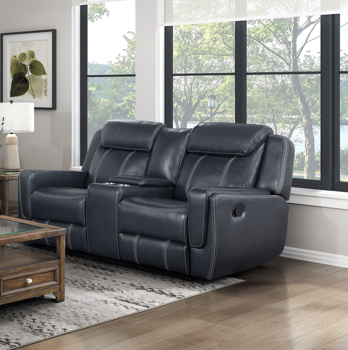 Dark gray leather loveseat recliner with white contrast stitching and cup holders perfect for home theaters