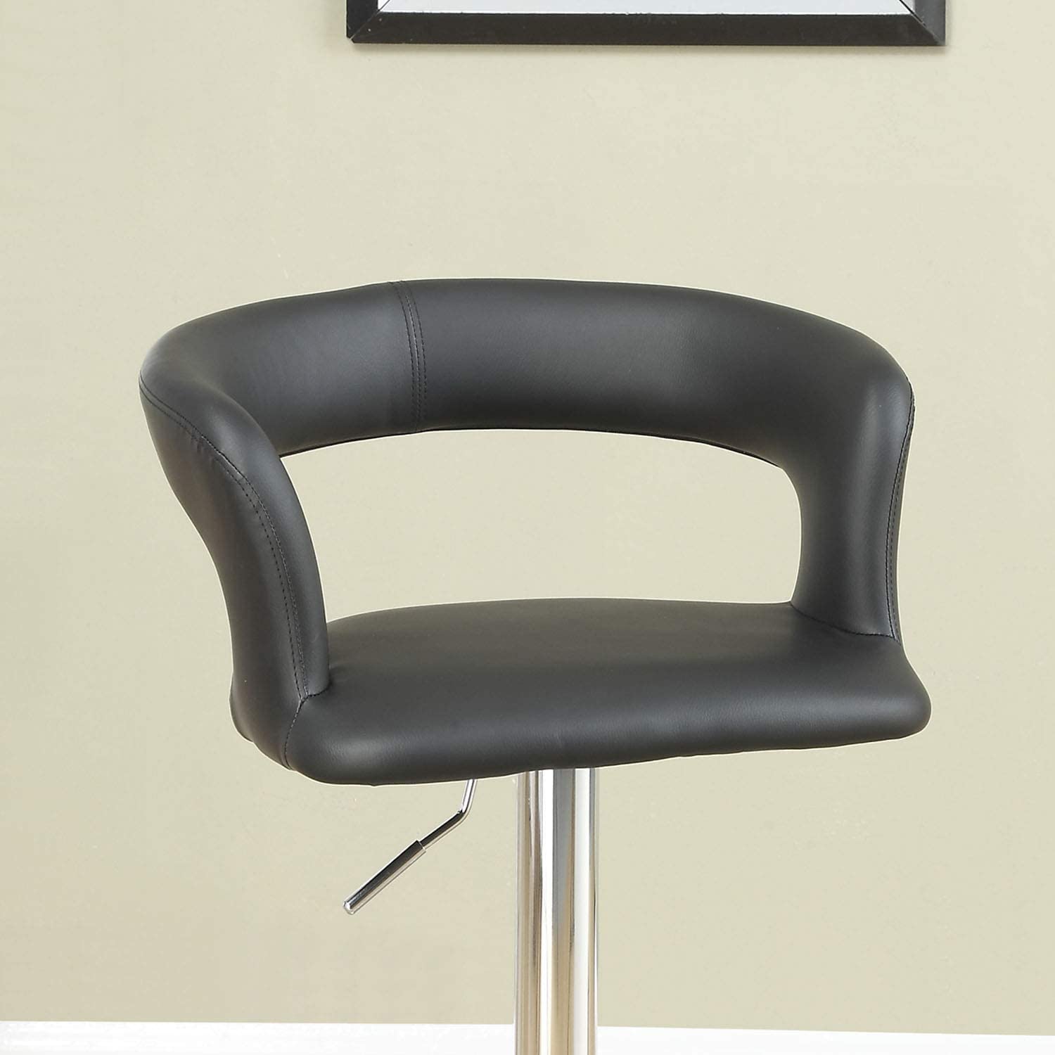 Black faux leather bar stool with curved back and silver adjustable lever