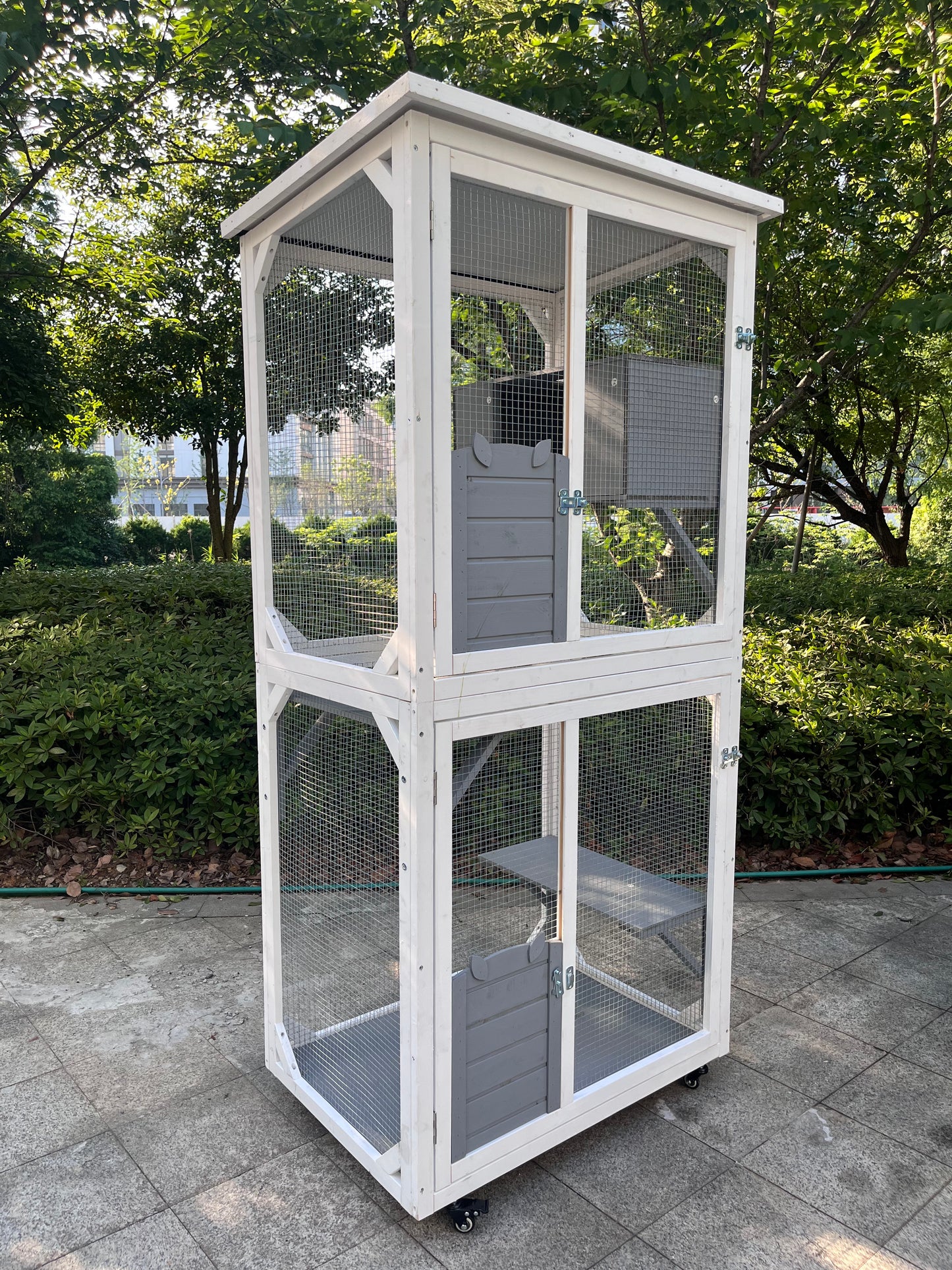 Tall white and grey wooden catio with mesh panels and multiple levels for outdoor pets