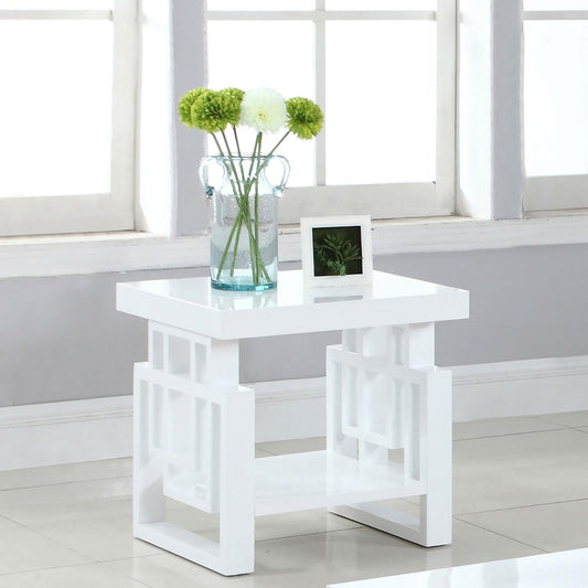 Modern white end table with open geometric shelf and glass vase of greenery