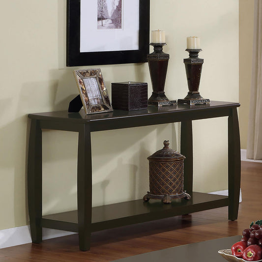 Dark wood console table with decorative items and artwork perfect for entryway decor