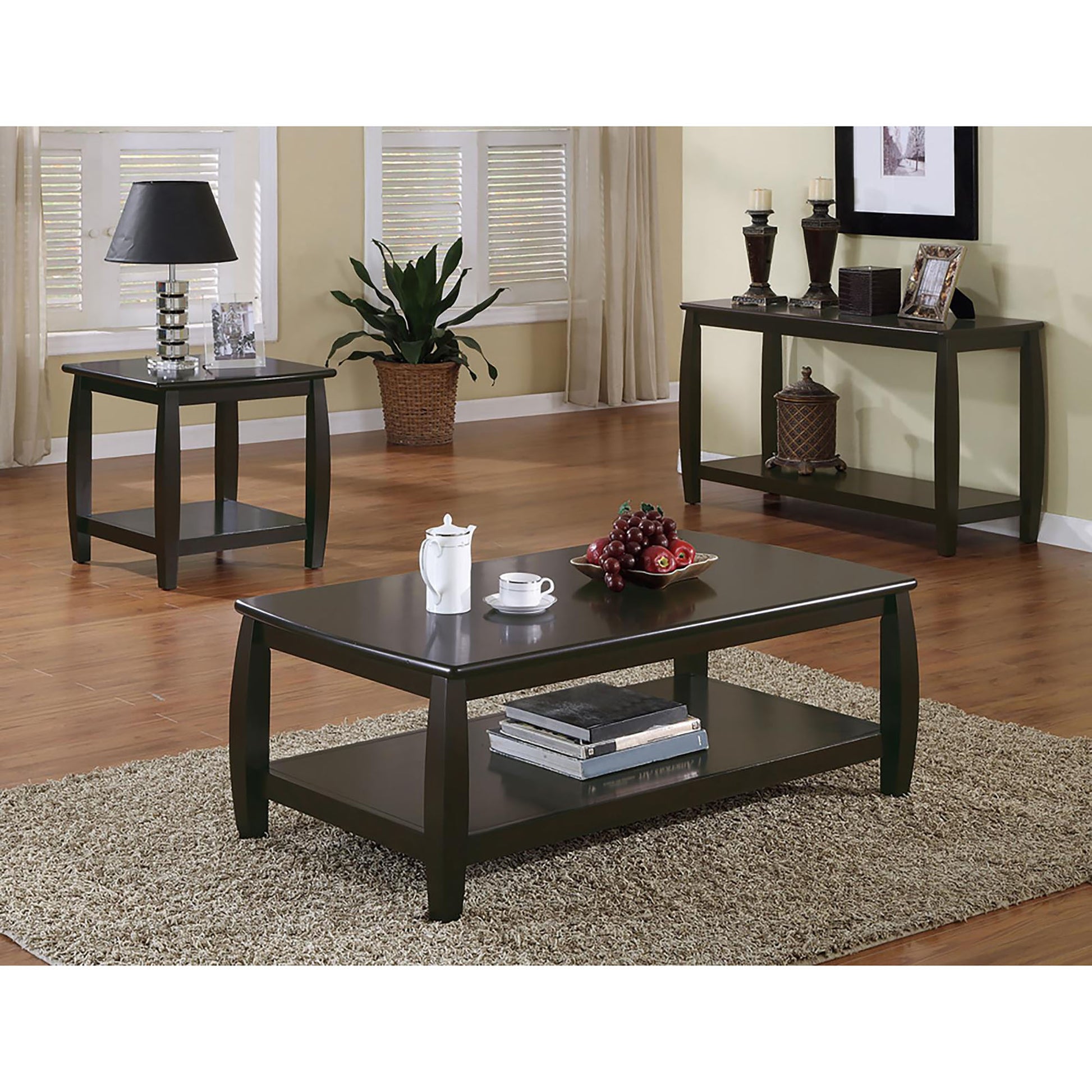 Dark espresso coffee table with stacked books and fruit bowl perfect for living rooms