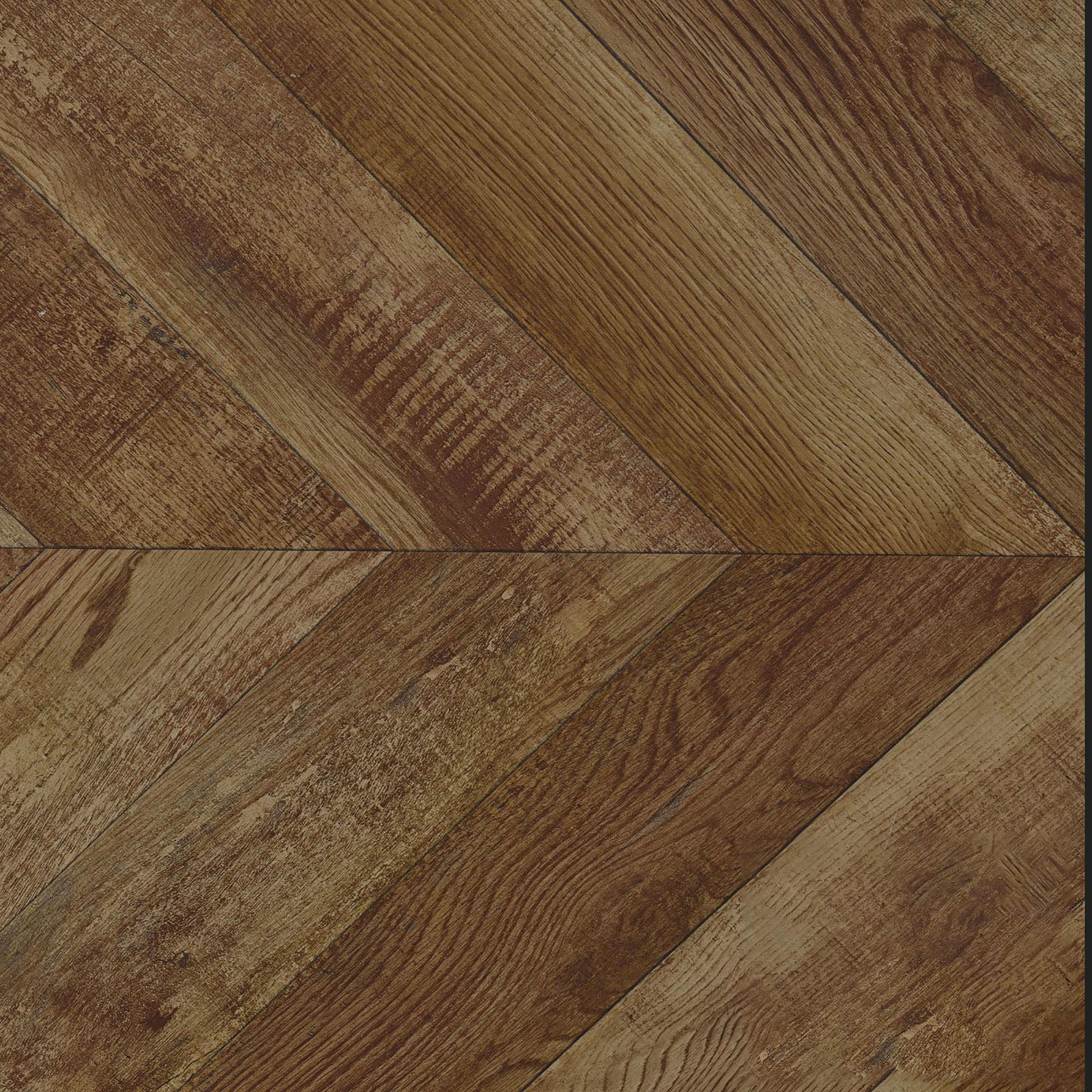 Closeup of distressed brown wood planks in a chevron pattern ideal for rustic flooring