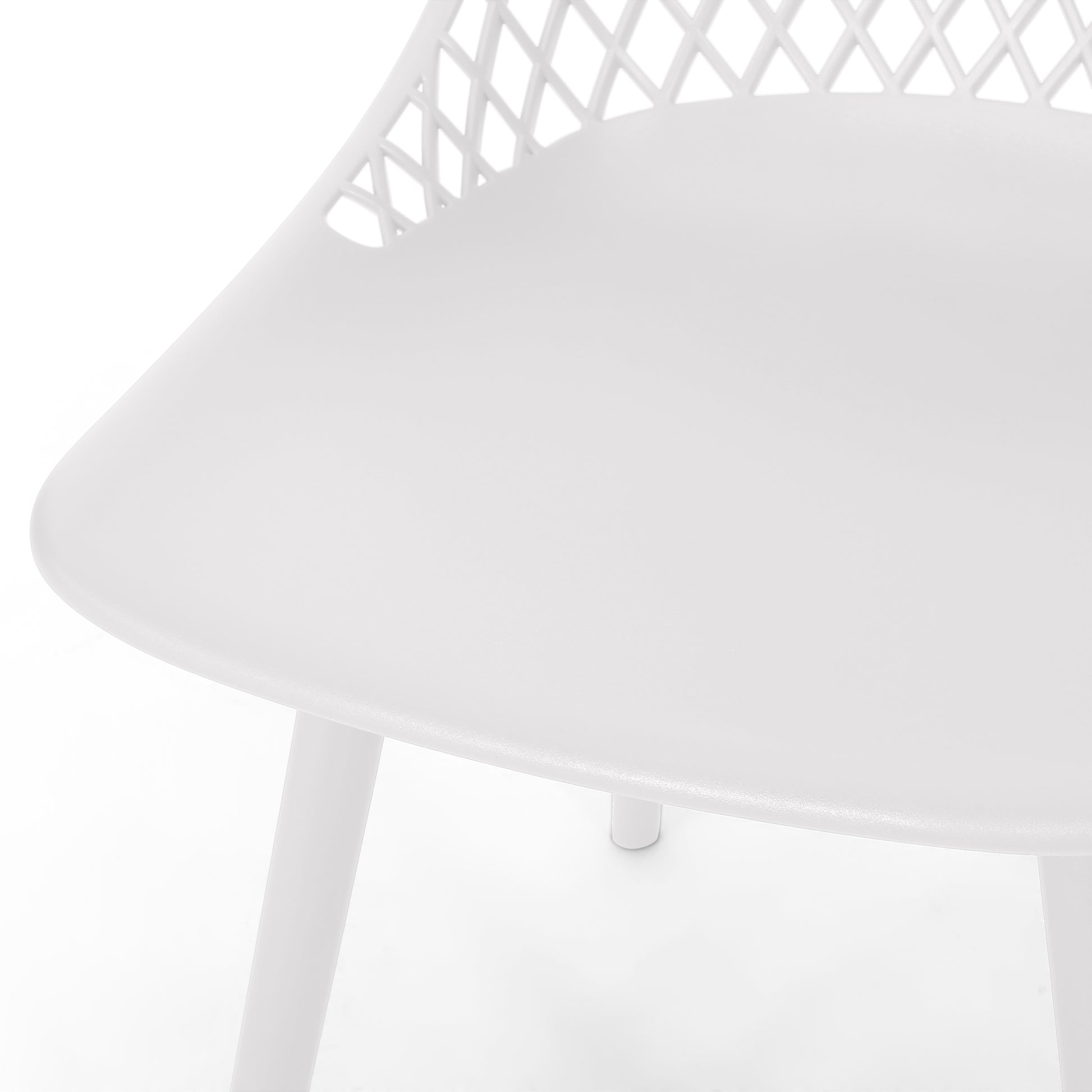 Close up of a white modern plastic chair with a diamond pattern back
