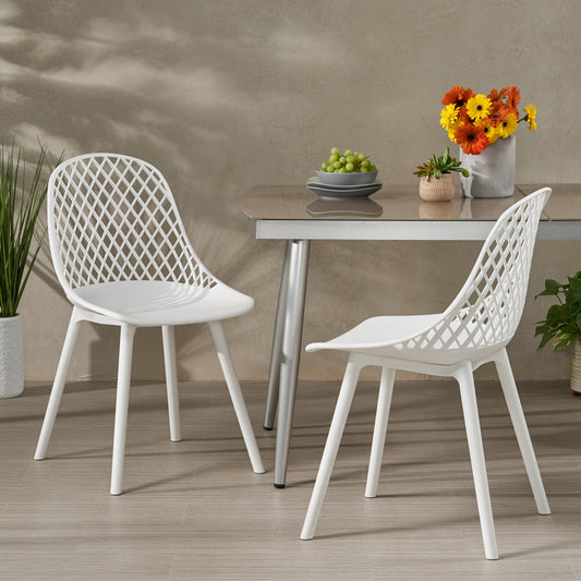 White diamondpatterned plastic chair with slender legs perfect for modern dining
