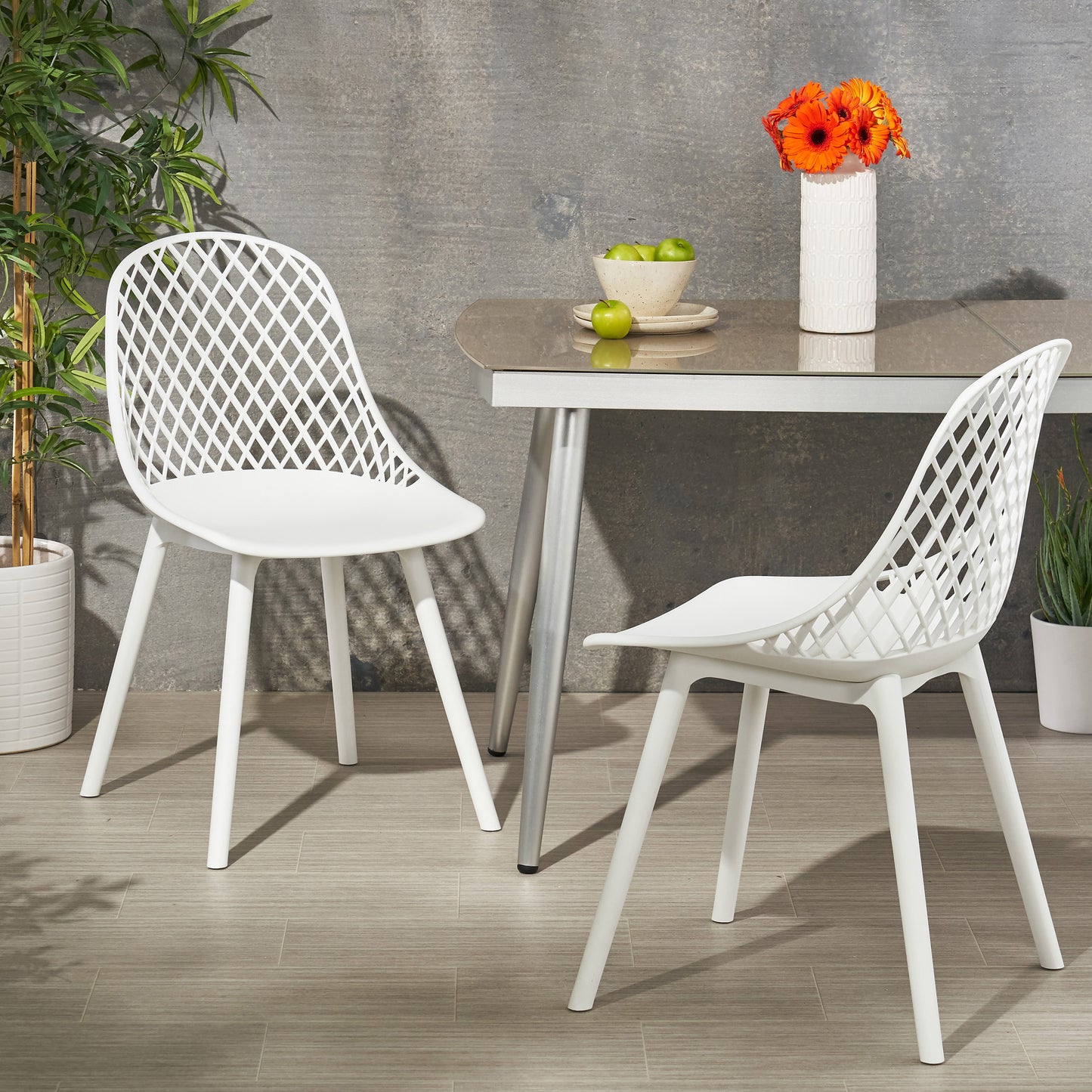 Modern white plastic dining chair with diamond lattice back and four tapered legs