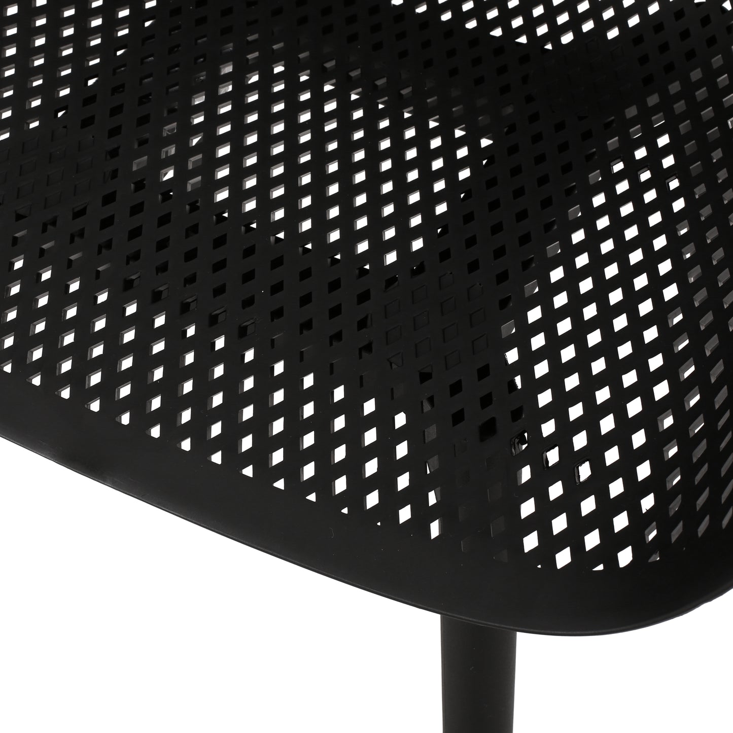 Closeup of a black metal patio chair seat with a diamondshaped perforated pattern