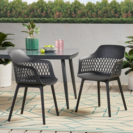 Modern black plastic outdoor armchair with diamondpatterned back and arms