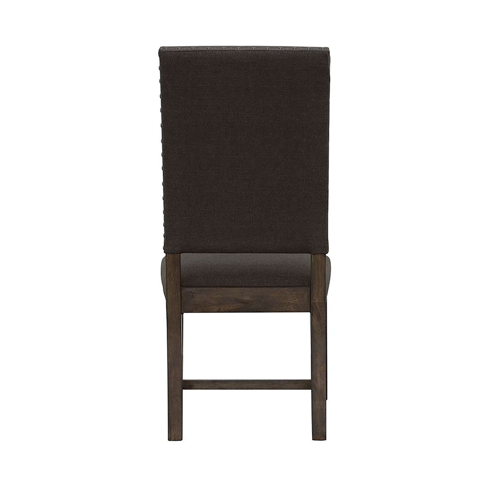 Upholstered dining chair with dark brown fabric nailhead trim and a wooden frame