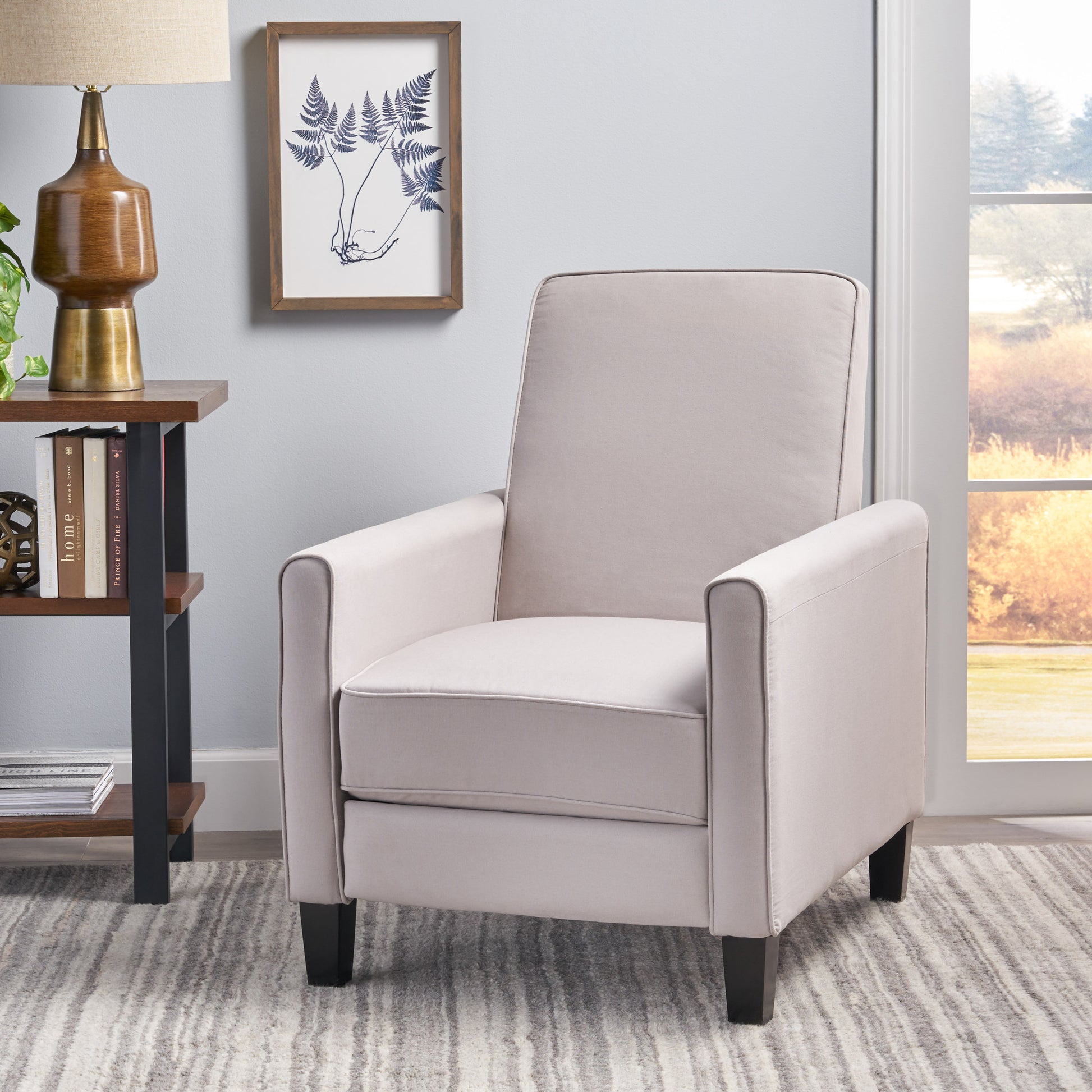 Comfortable cream upholstered recliner chair with dark wooden legs perfect for living rooms