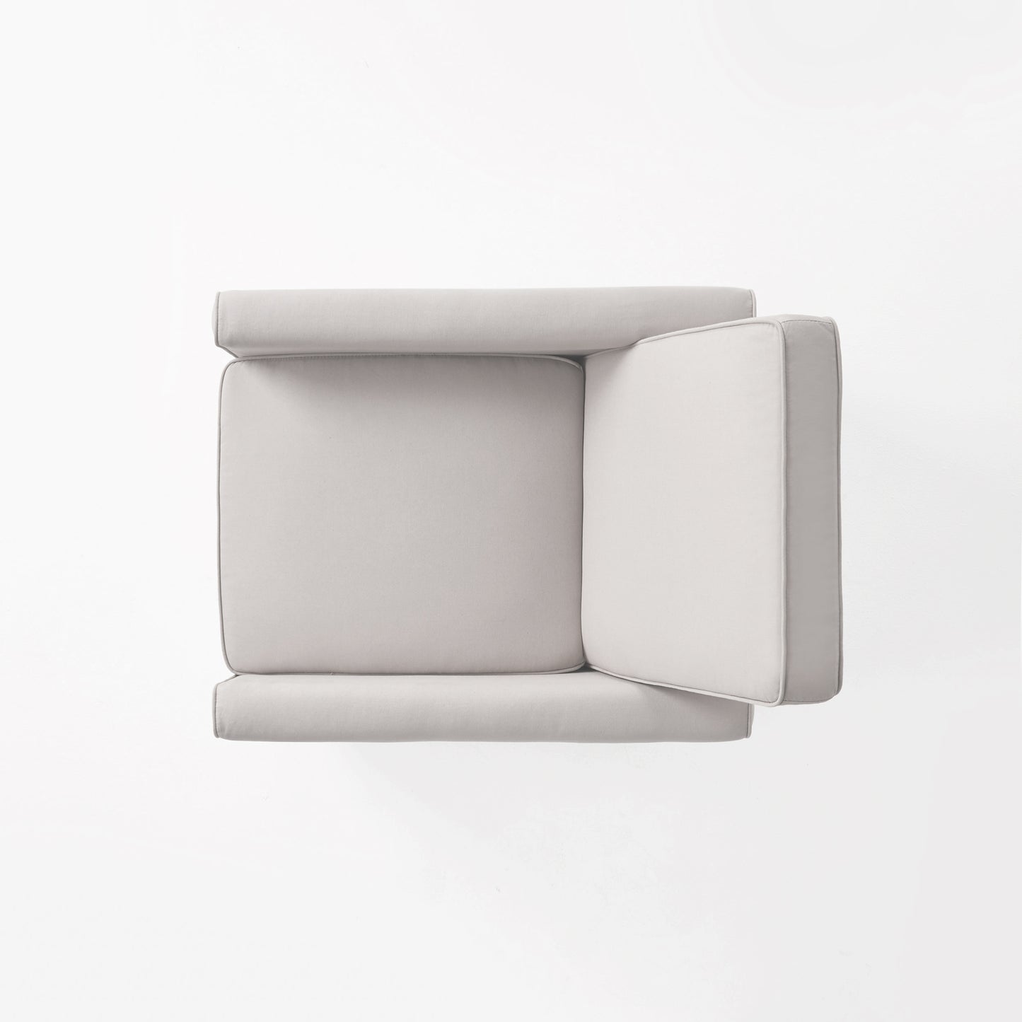 Topdown view of a light grey sectional sofa with piped edges