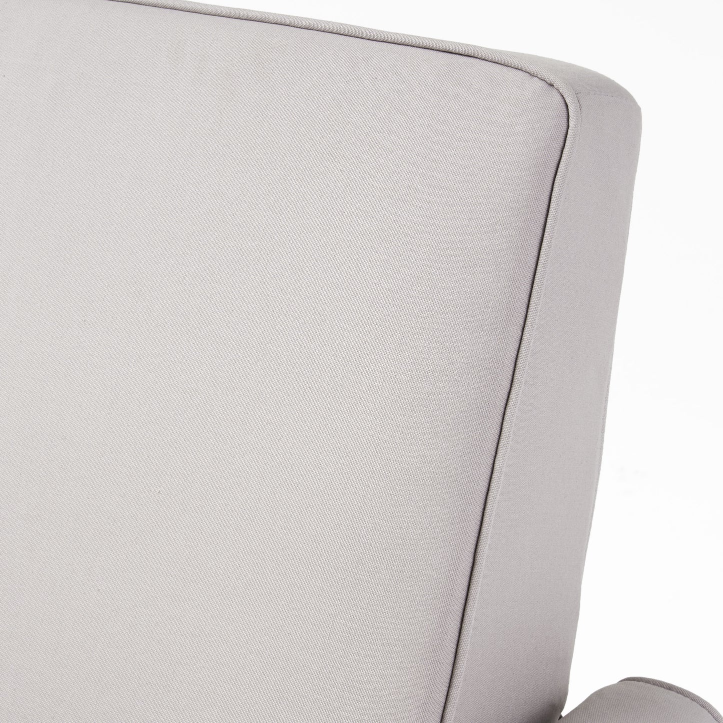 Closeup of light gray woven fabric texture with clean piping detail on a couch cushion