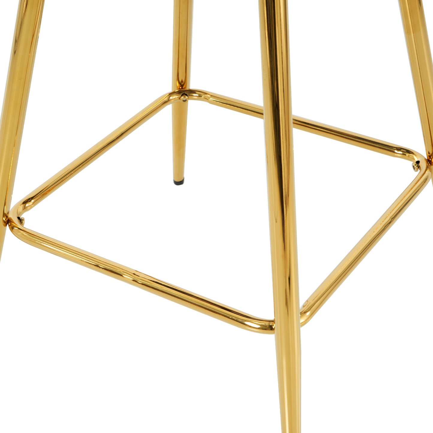 Closeup of the polished gold metal frame and legs of a modern bar stool