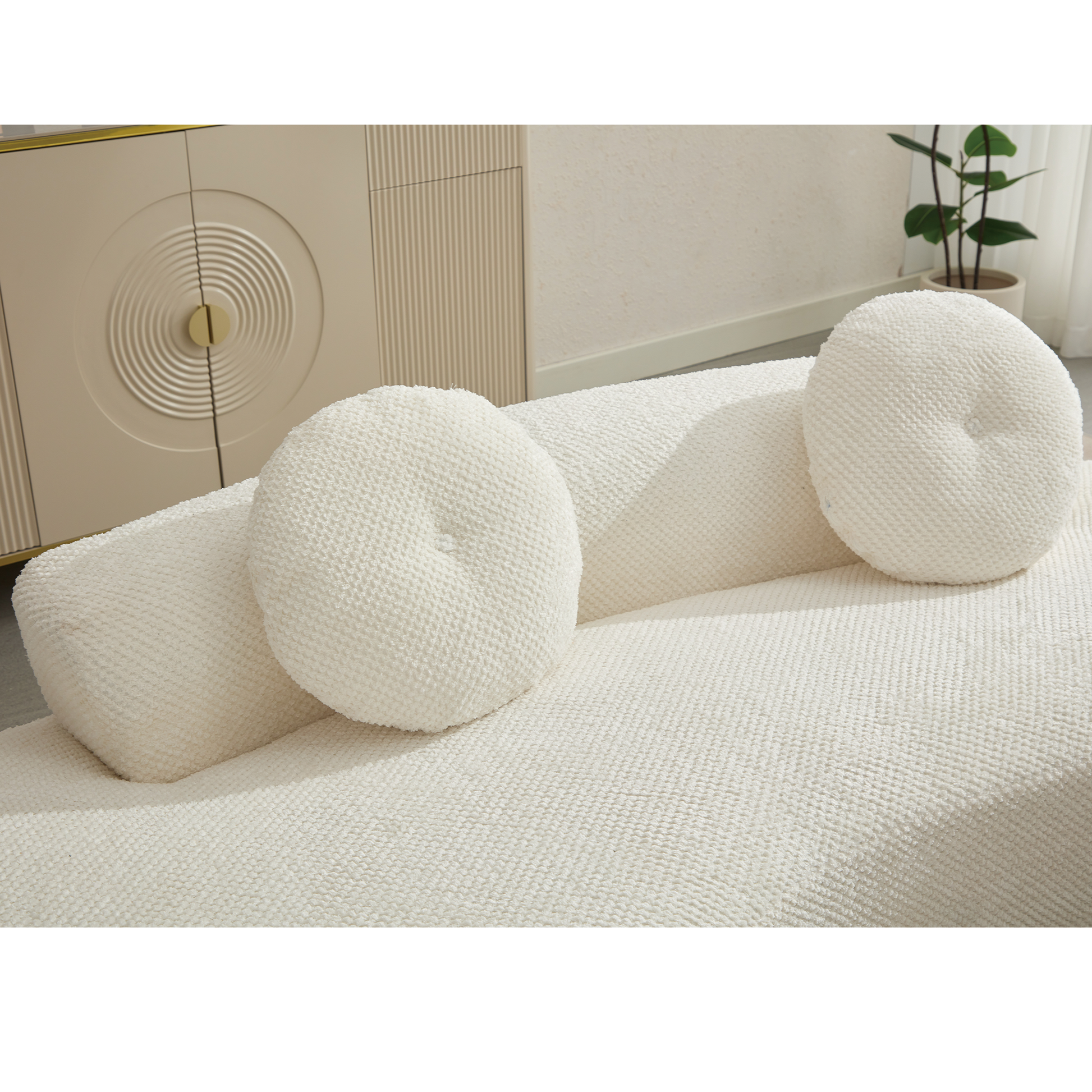 Textured white boucle throw pillow with tufted center accent