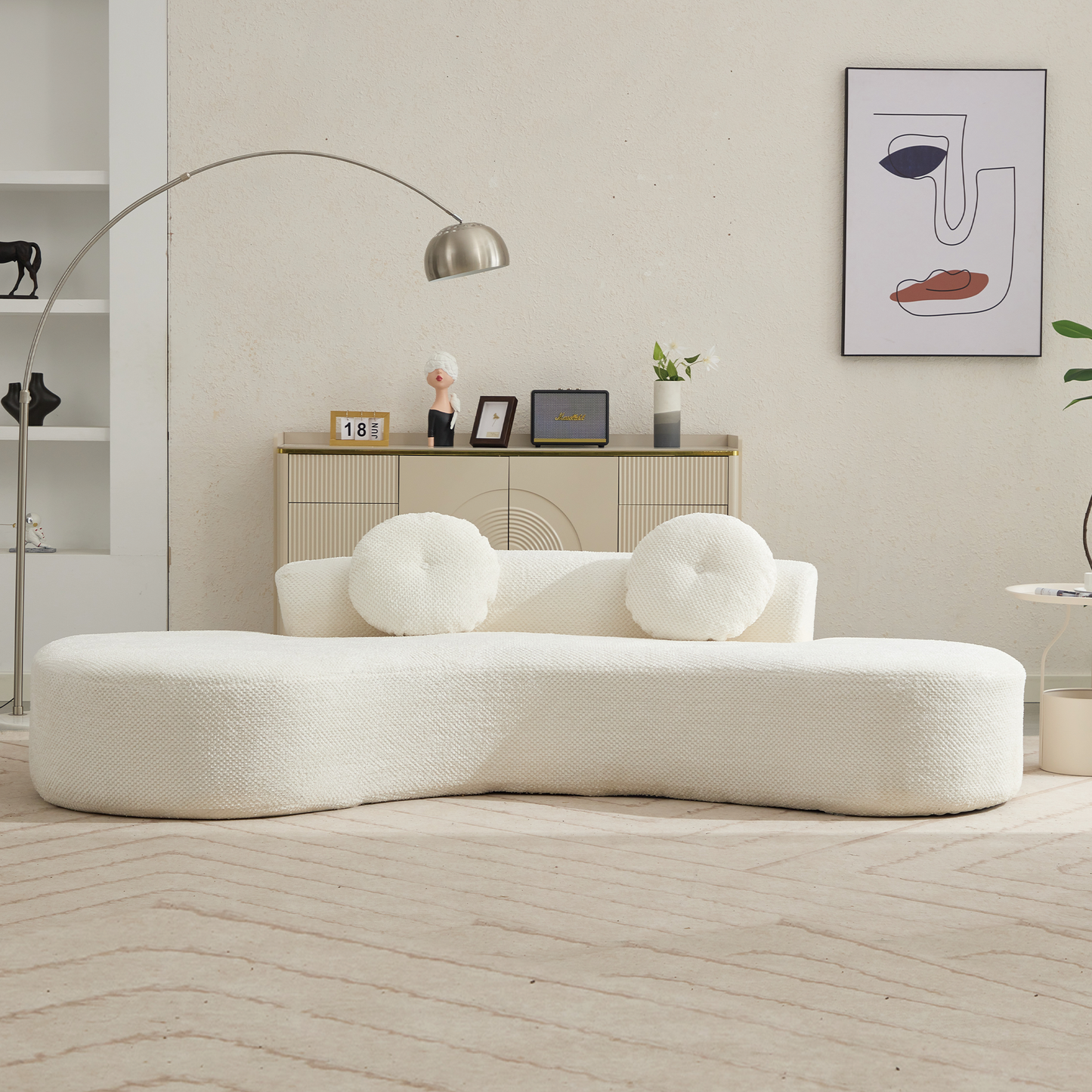 Curved cream boucle fabric sofa with two round cushions for modern living room accent