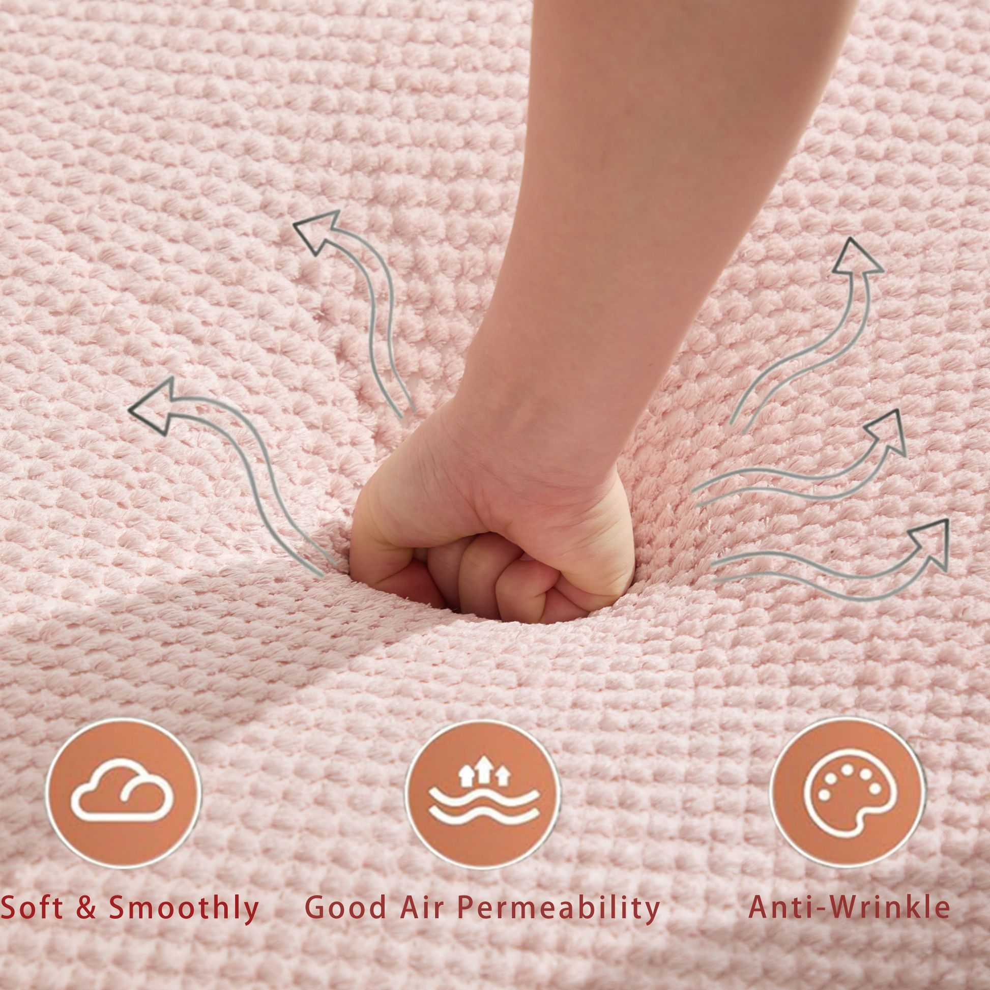 Closeup of textured pink chenille fabric with a hand pressing into it showing softness and air permeability
